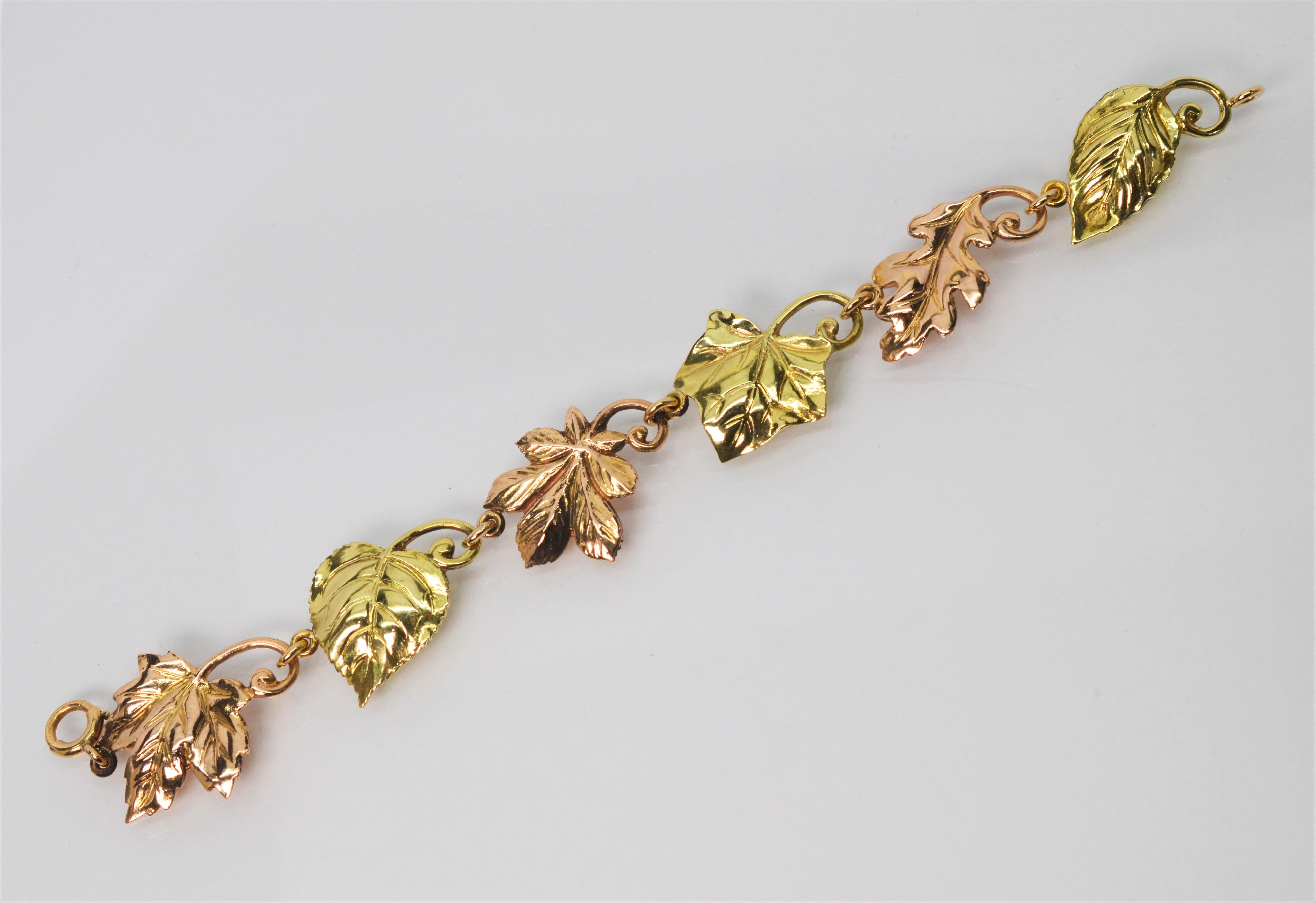 Beautifully crafted by Tiffany & Co. circa 1950's , this bracelet displays a potpourri of fourteen 14k karat rose and yellow gold leaves artfully linked to 
create this 7 1/2 inch bracelet. The alternating gold hues and different leaf varieties give