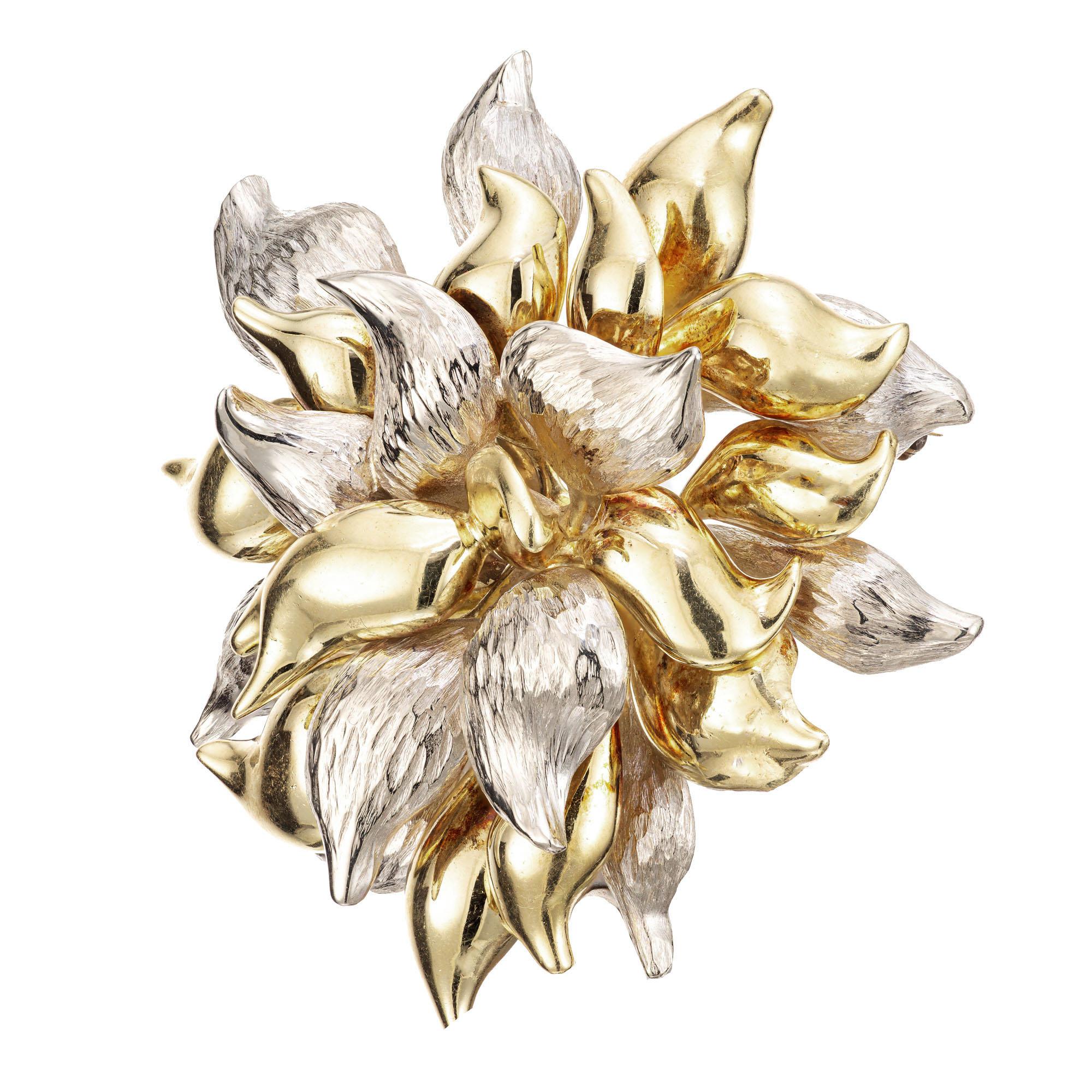 1950's Tiffany & Co. 18k yellow and white gold textured, 3D flower brooch. Signed Tiffany Italy. 

Diameter: 51.85mm or 2.04 inches
Depth: 18.42mm
40.7 grams
Tested: 18k
Stamped: K18 Italy
Hallmark: Tiffany