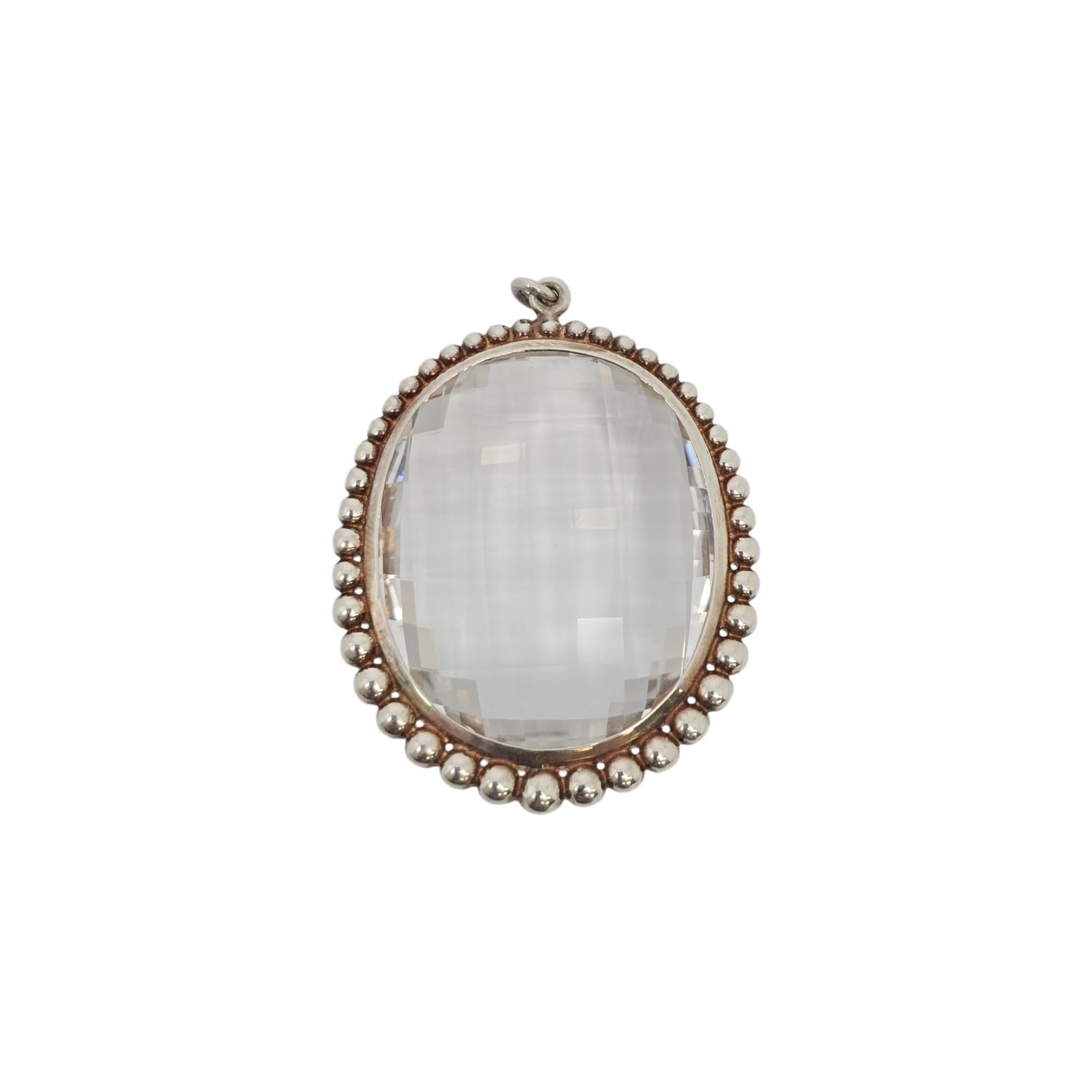 Tiffany & Co Ziegfeld Collection Oval Rock Crystal sterling silver pendant.

This authentic Tiffany pendant features a faceted oval rock crystal in a sterling silver beaded frame. Piece originally included a chain, but the chain is missing and not