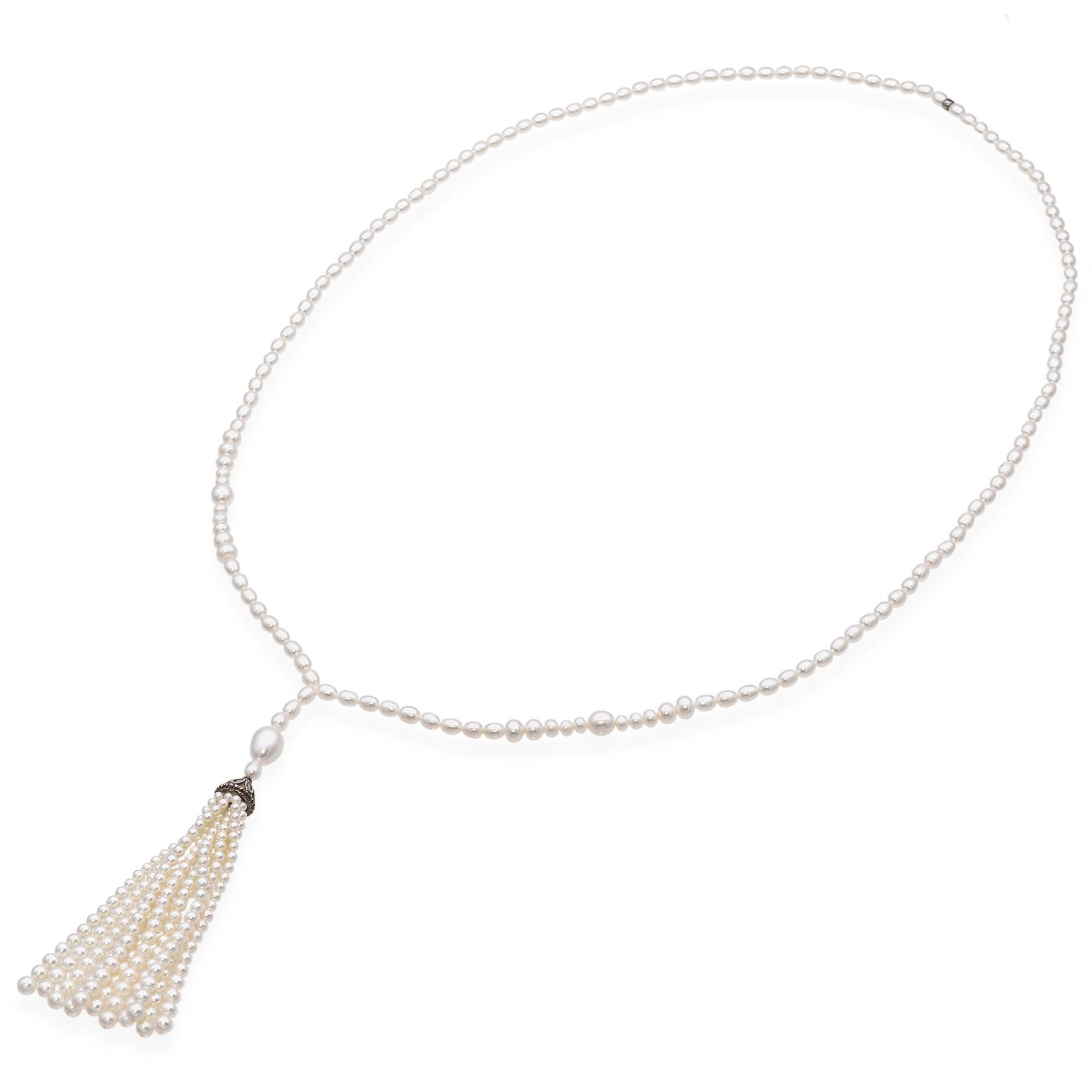 Freshwater pearl tassel necklace featuring a single strand of pearls leading to a sterling silver cap with intricate detailing, suspending multiple strands of pearls forming a tassel. Created by Tiffany & Co.

Weight 48.6 grams
Stone: Freshwater