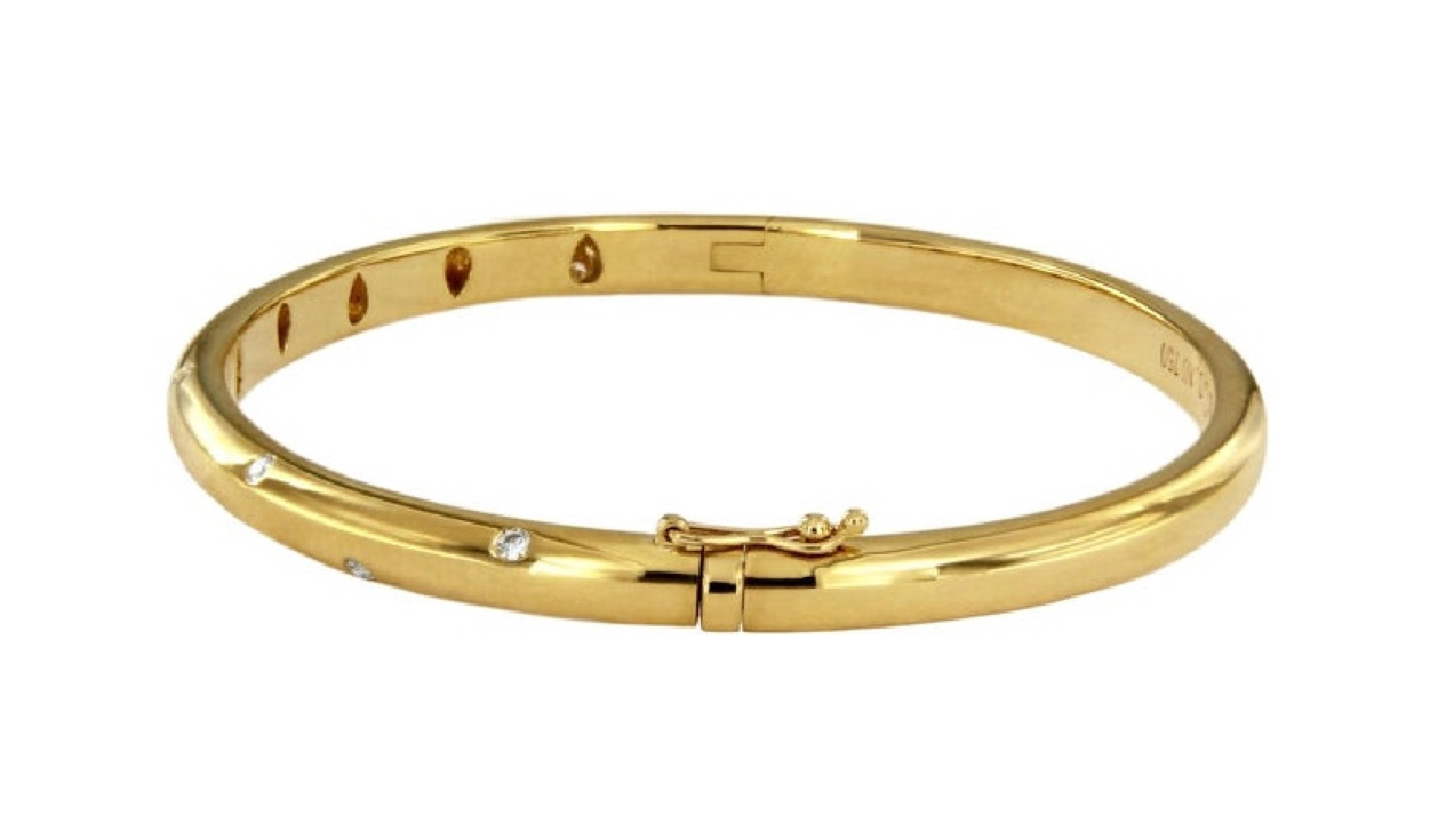 *Mint condition
-18k gold with round brilliant diamonds
-Carat total weight .21
-Width: 4.5mm
-Outer circumference: 7.2”
-Fits wrists up to 6.25