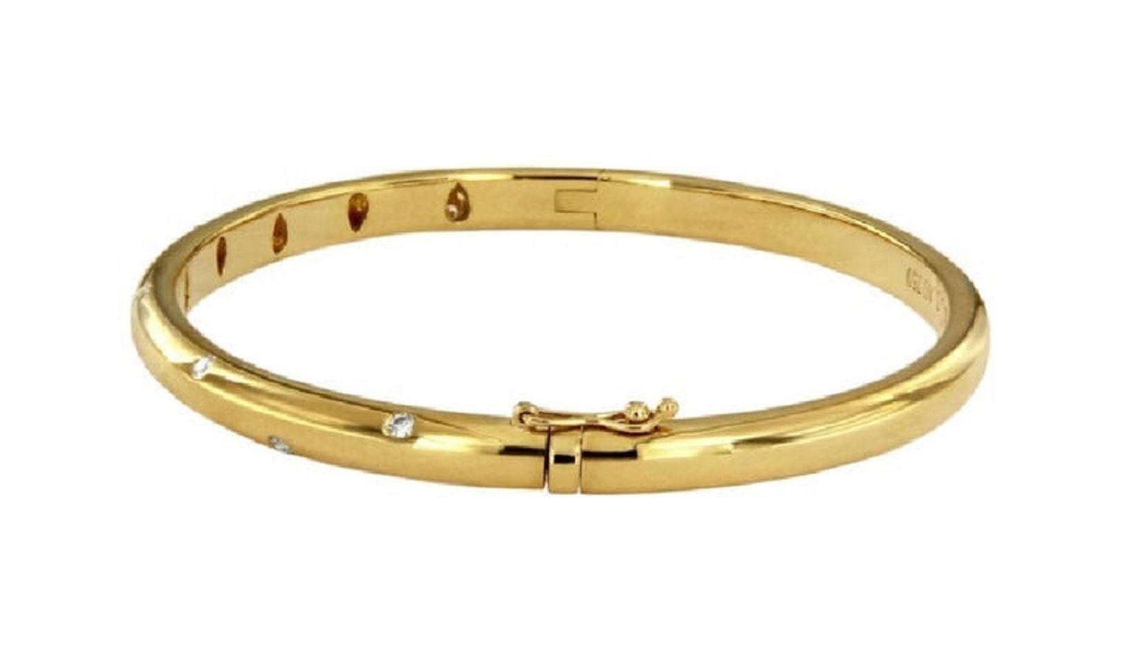 *Mint condition
-18k gold with round brilliant diamonds
-Carat total weight .21
-Width: 4.5mm
-Outer circumference: 7.2”
-Fits wrists up to 6.25