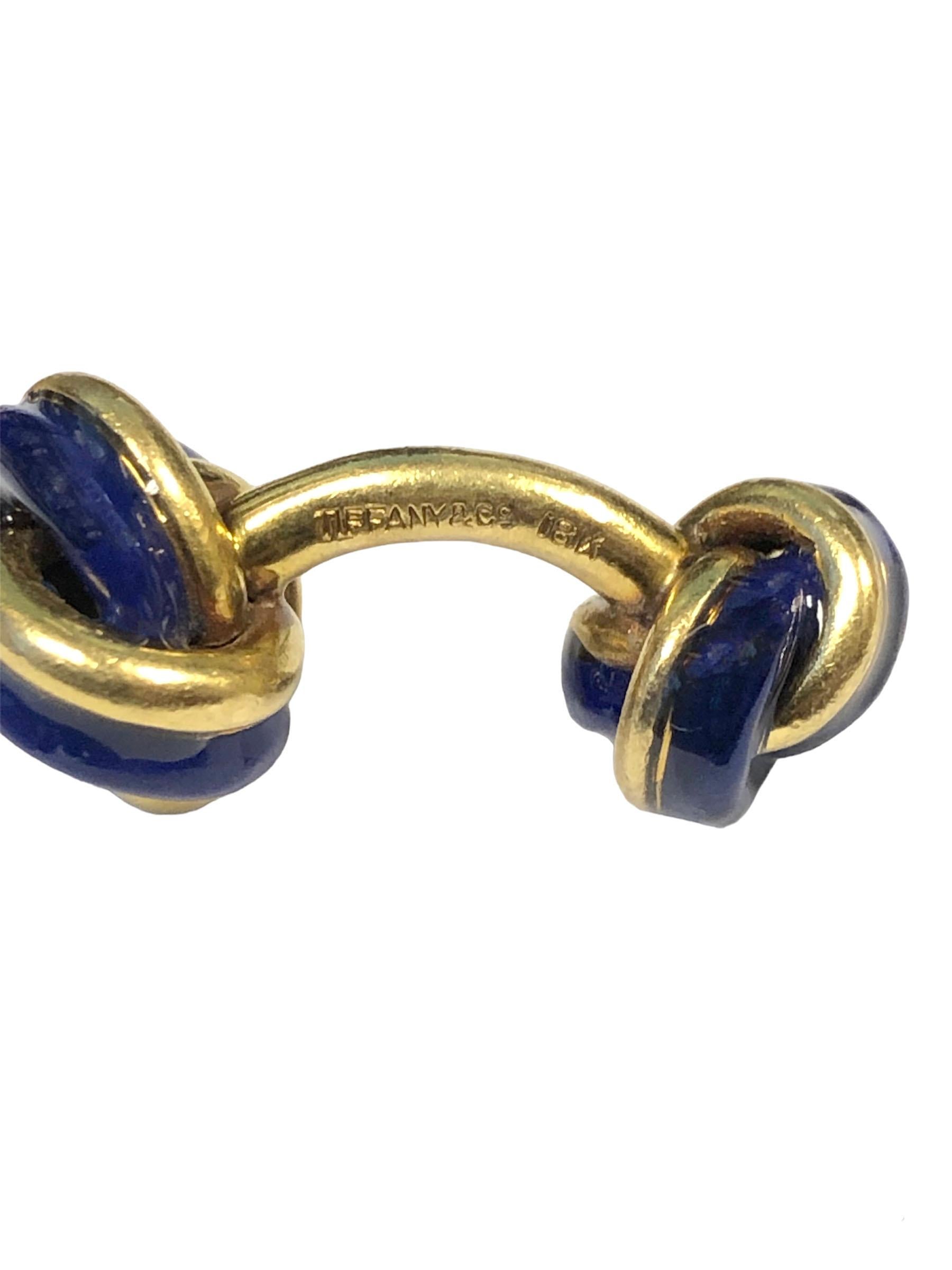 Circa 1980s Tiffany & Company 18k Yellow Gold and Cobalt Blue Enamel Knot form Cufflinks, measuring 1 inch in length with the bigger / top knot measuring 1/2 inch in diameter, nice sold heavy construction, weighing 23 Grams. 