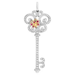 Tiffany 
Company 18K Two Tone Gold Ruby and Diamond Butterfly Key Pendant