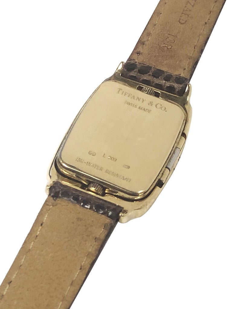 Tiffany and Company 2 Time Zone Yellow Gold Mid Size Wrist Watch at 1stDibs