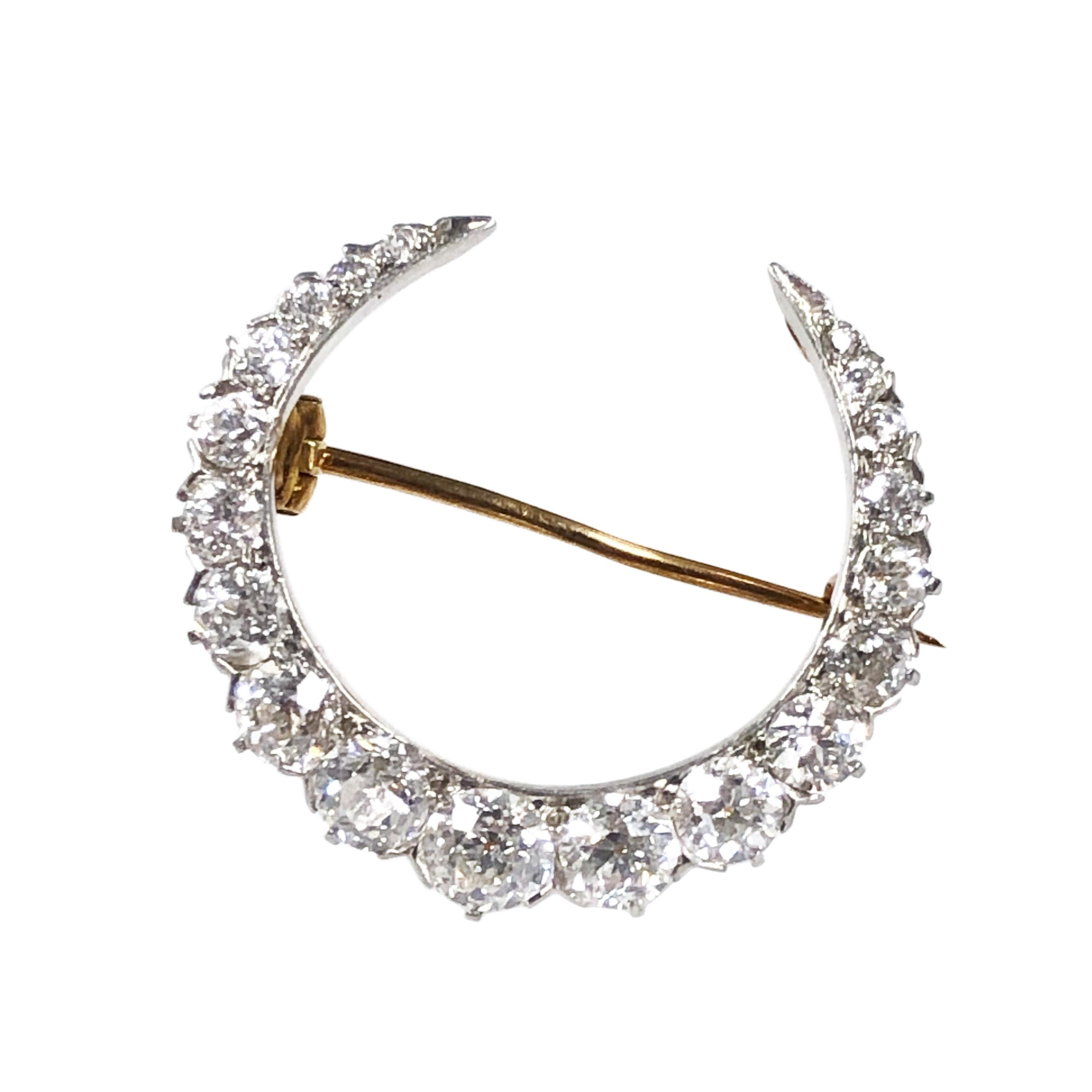 Circa 1915 Tiffany & Company Crescent Brooch, Platinum top with Yellow Gold back, measuring 1 1/8 inch in length, 1 1/8 inch in diameter, set with Old Mine cut Diamonds totaling 3.50 Carats and Grading as G - H in color and VS in Clarity. Comes in