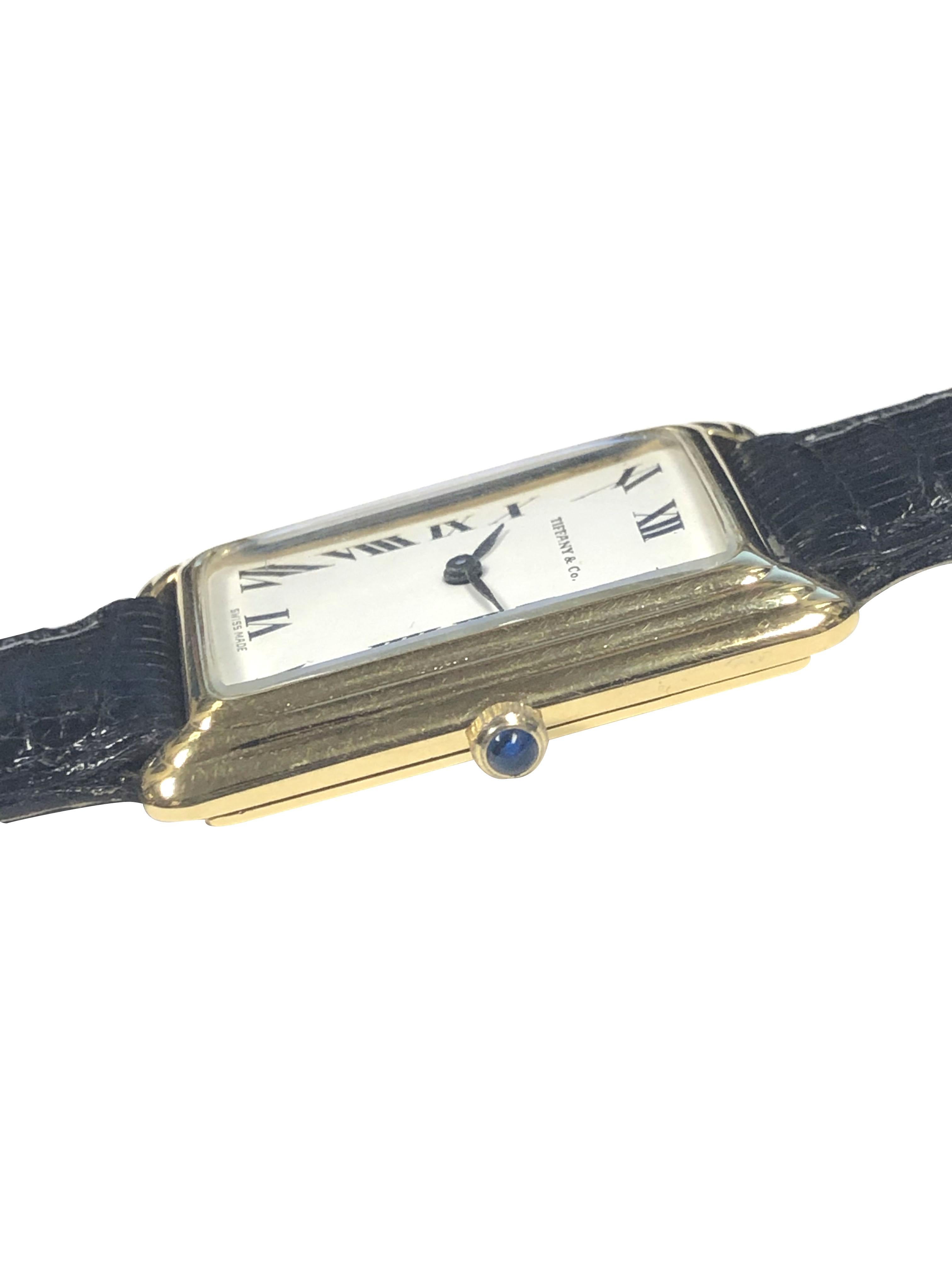 Circa 1970s Concord for Tiffany & Company Wrist Watch, 35 X 25 M.M. 18K Yellow Gold 2 Piece Stepped case, 17 Jewel Mechanical, manual wind movement. White dial with Black Roman numerals, Sapphire Crown. New Morellato Italy Black Lizard strap with