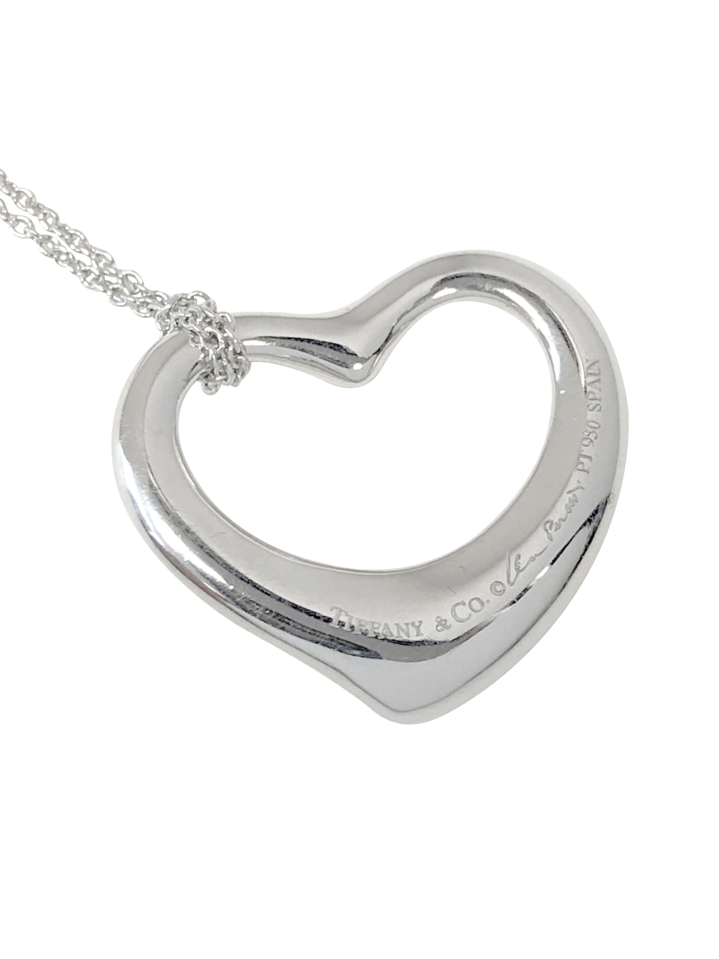 Circa 2000 Elsa Peretti for Tiffany & Company Platinum Floating Heart pendant, measuring 7/8 X 3/4 inch and is set with Diamonds totaling .15 Carat, suspended from a 16 inch Platinum chain and comes in a Tiffany presentation box.