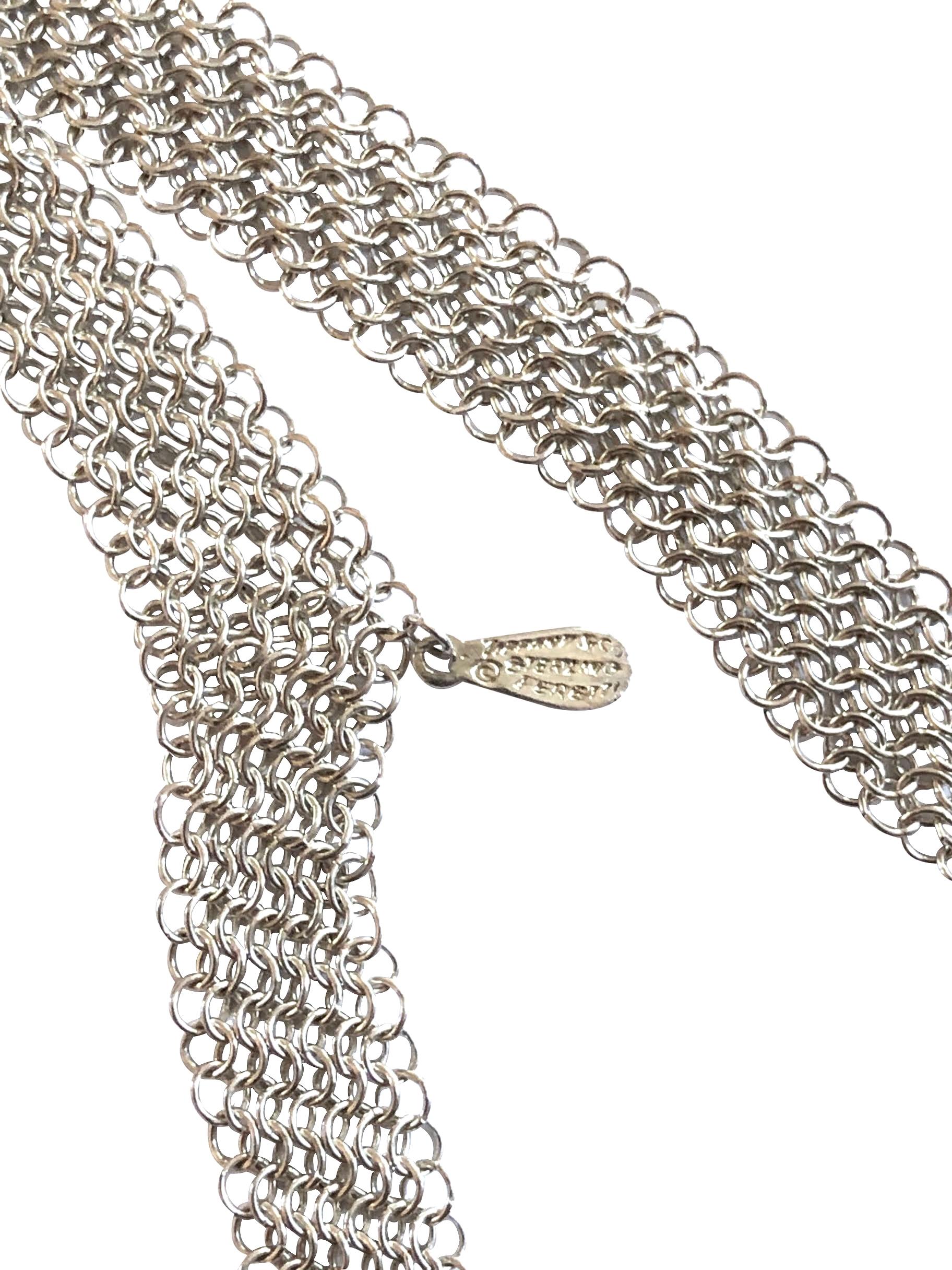 Circa 1980s Elsa Peretti for Tiffany & Company Sterling Silver link Mesh Bib wrap around Necklace, measuring 26 inches in length and 1 3/4 inches wide at the center. Excellent condition and comes in a Tiffany suede pouch.