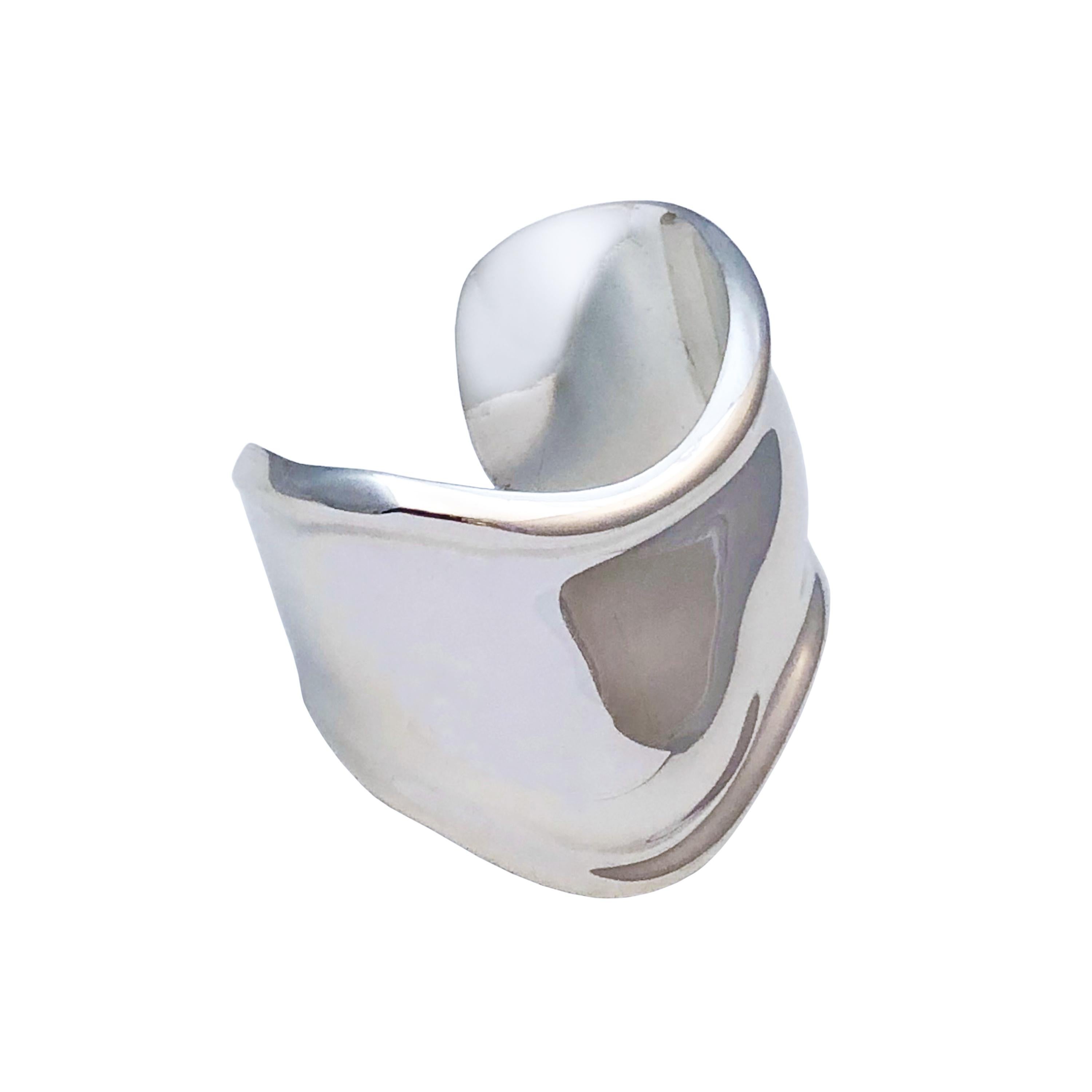 Circa 1980 Elsa Peretti for Tiffany & Company Large Sterling Silver Bone Cuff Bracelet. measuring 2 inches wide, inside measurement 6 1/2 inches and an opening of 1 1/4 inches. Comes in original Tiffany & company Pouch.