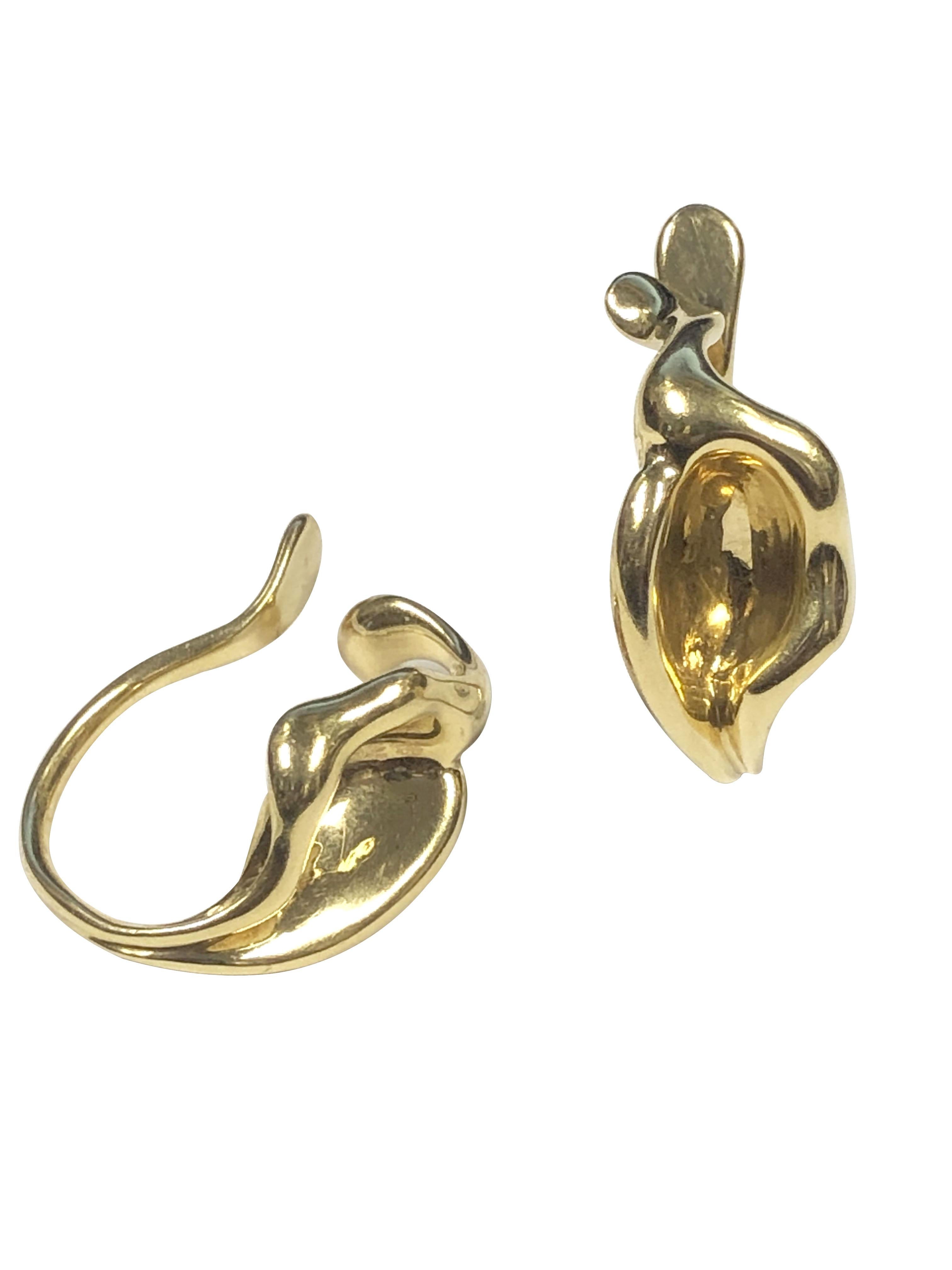 Circa 1980 Elsa Peretti for Tiffany & Company 18k Yellow Gold Calla Lily Flower Earrings, measuring 1 1/8 inches in length X 5/8 inch wide and weighing 18.4 Grams. These are the earlier of the collection, harder to find pair that are pressure fit