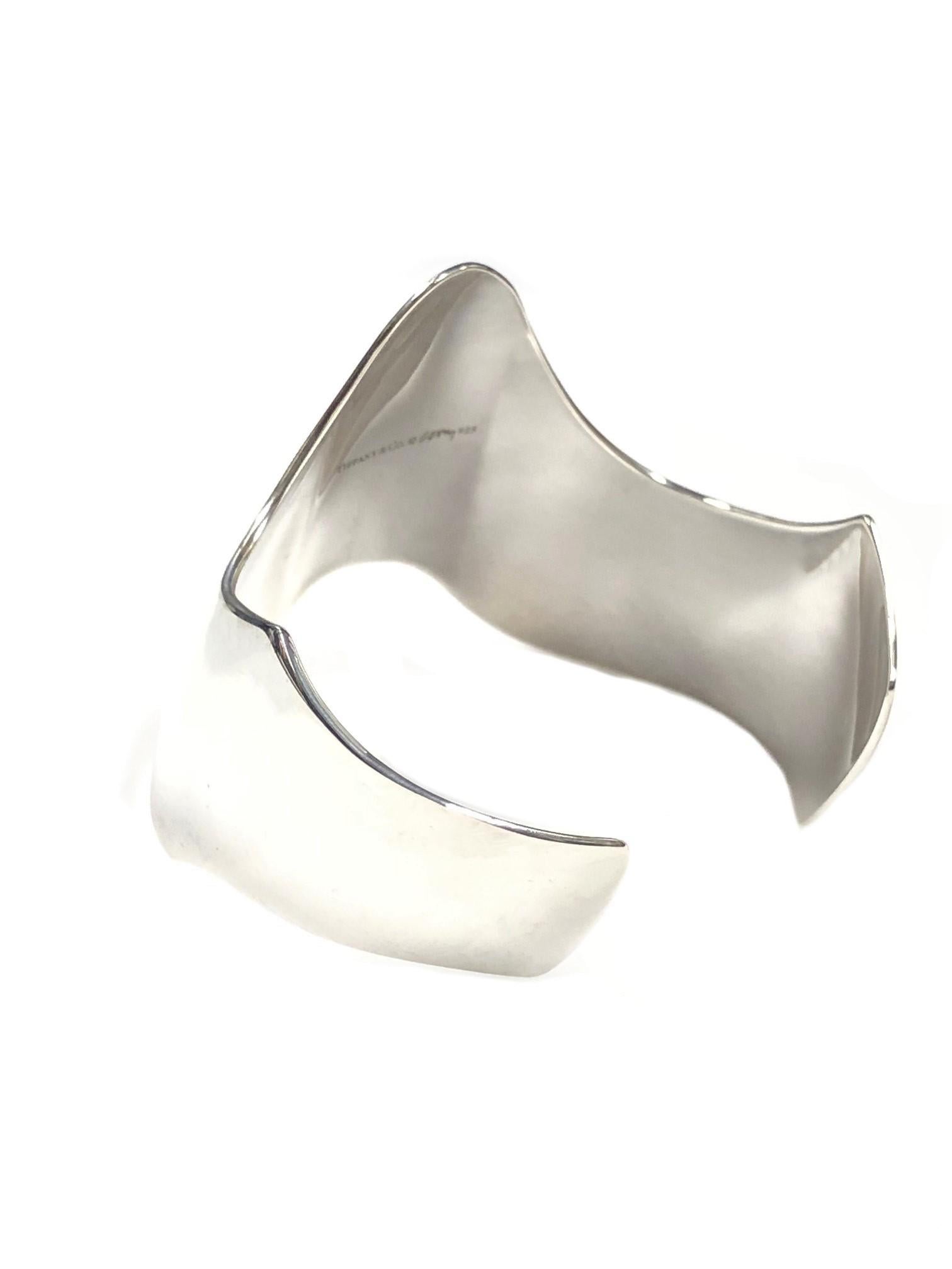 Circa 2000 Frank Gehry for Tiffany & Company Sterling Silver Cuff Bracelet, in an eccentric design and measuring 2 inches wide with an opening of 1 1/4 inch. Inside measurement approximately 7 inches. 
