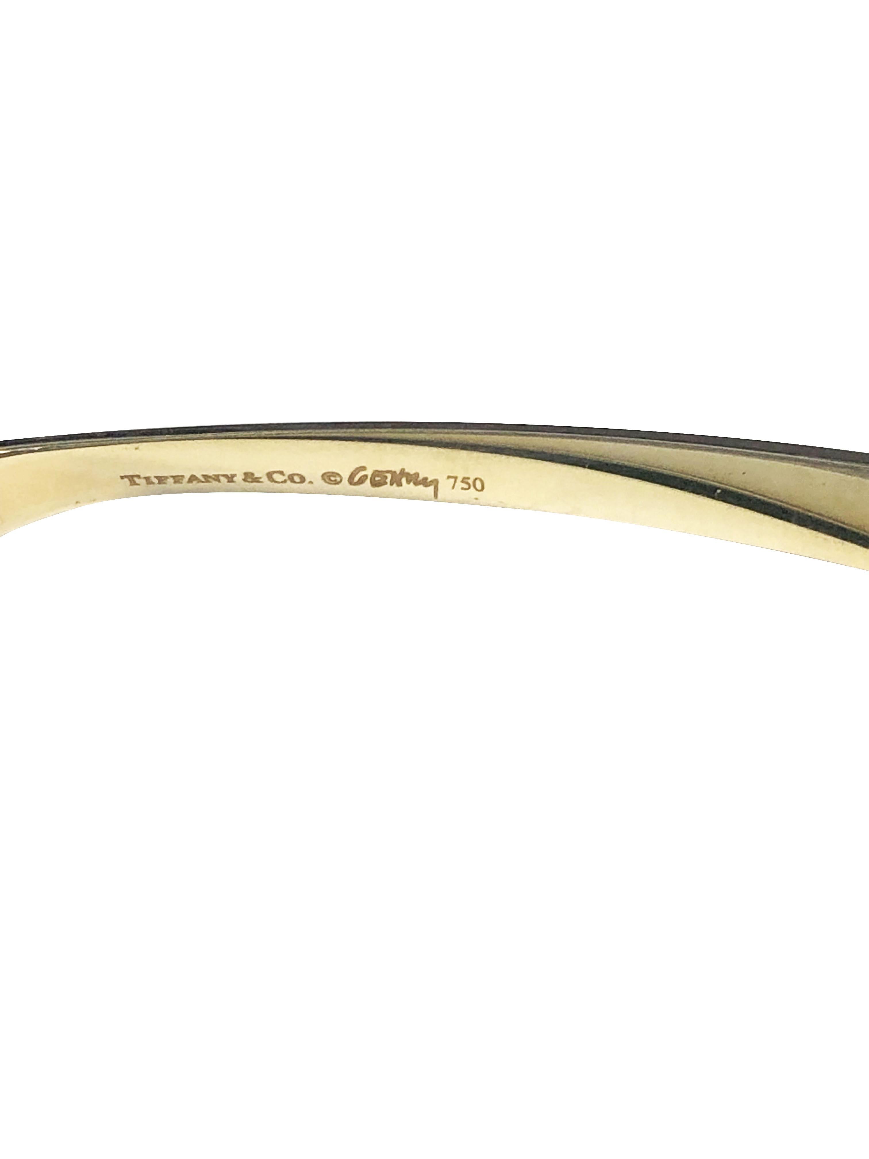 Circa 2000 Frank Gehry for Tiffany & Company 18K Yellow Gold Torque Bracelet, 3.5 M.M. wide with an inside measurement of 7 3/4 inches and weighing 22.6 Grams. Comes in a Tiffany Travel Pouch.