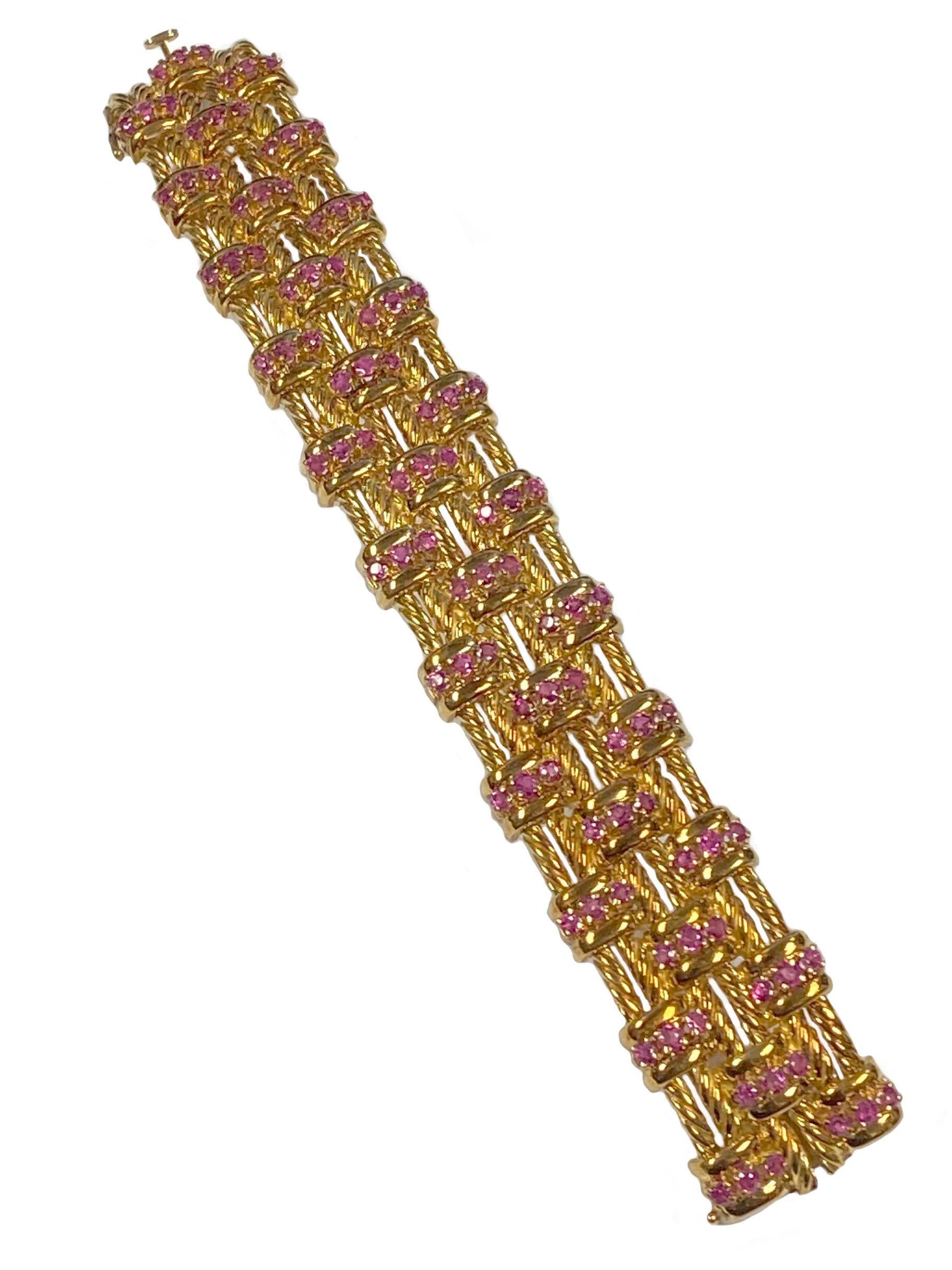 Circa 1960s Tiffany & Company 18k Yellow Gold Bracelet in a twisted Rope links design, measuring just under 1 inch wide, 6 7/8 inches in length and weighing 106 Grams. Set with round Rubies totaling 2.50 Carats.  