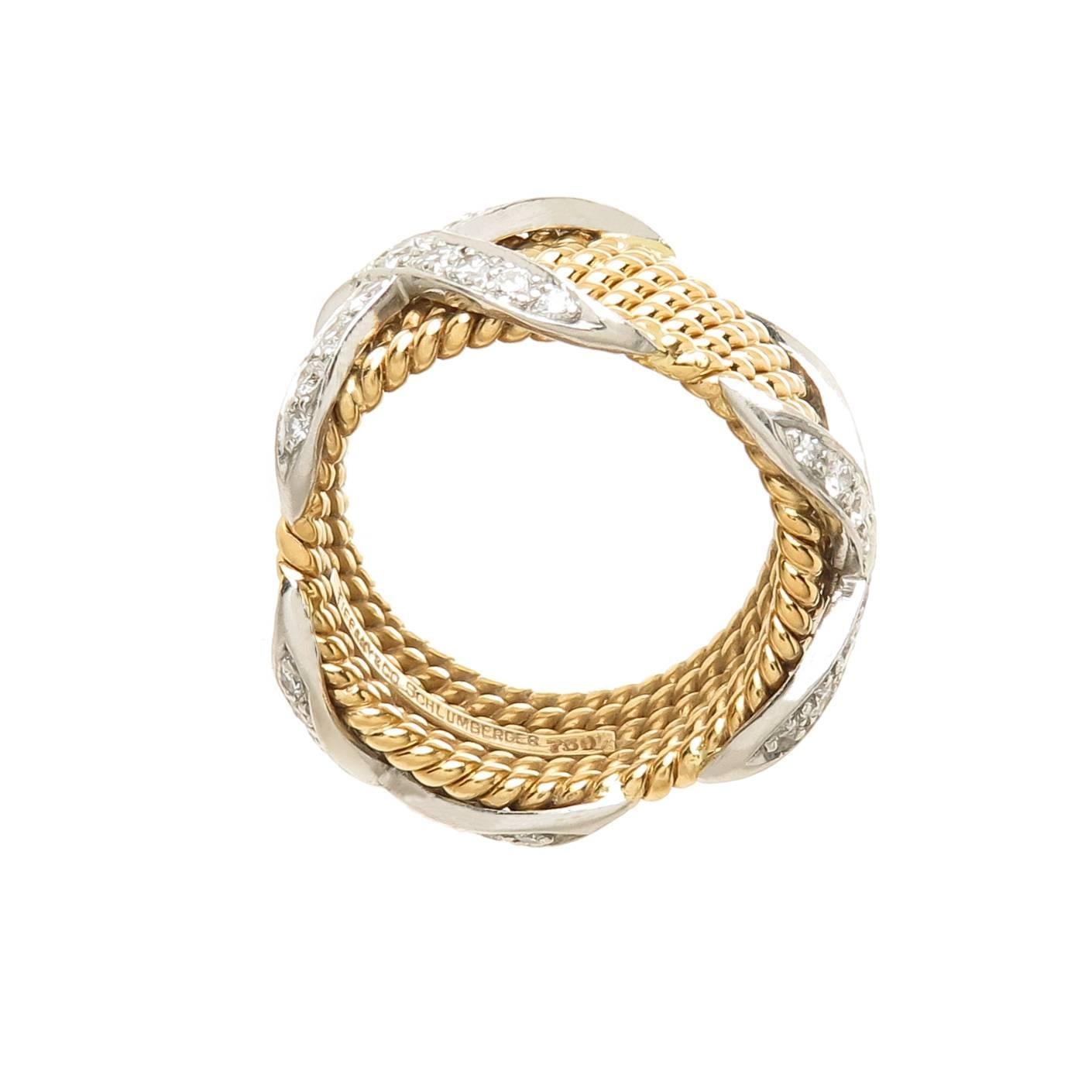 Circa 2000 Jean Schlumberger for Tiffany & Company, 18K Yellow and White Gold 6 row Rope, classic X Ring, set with Round Brilliant cut Diamonds totaling approximately 1 carat and Grading as F-G in color and VS in Clarity. The ring measures 7/16 Inch