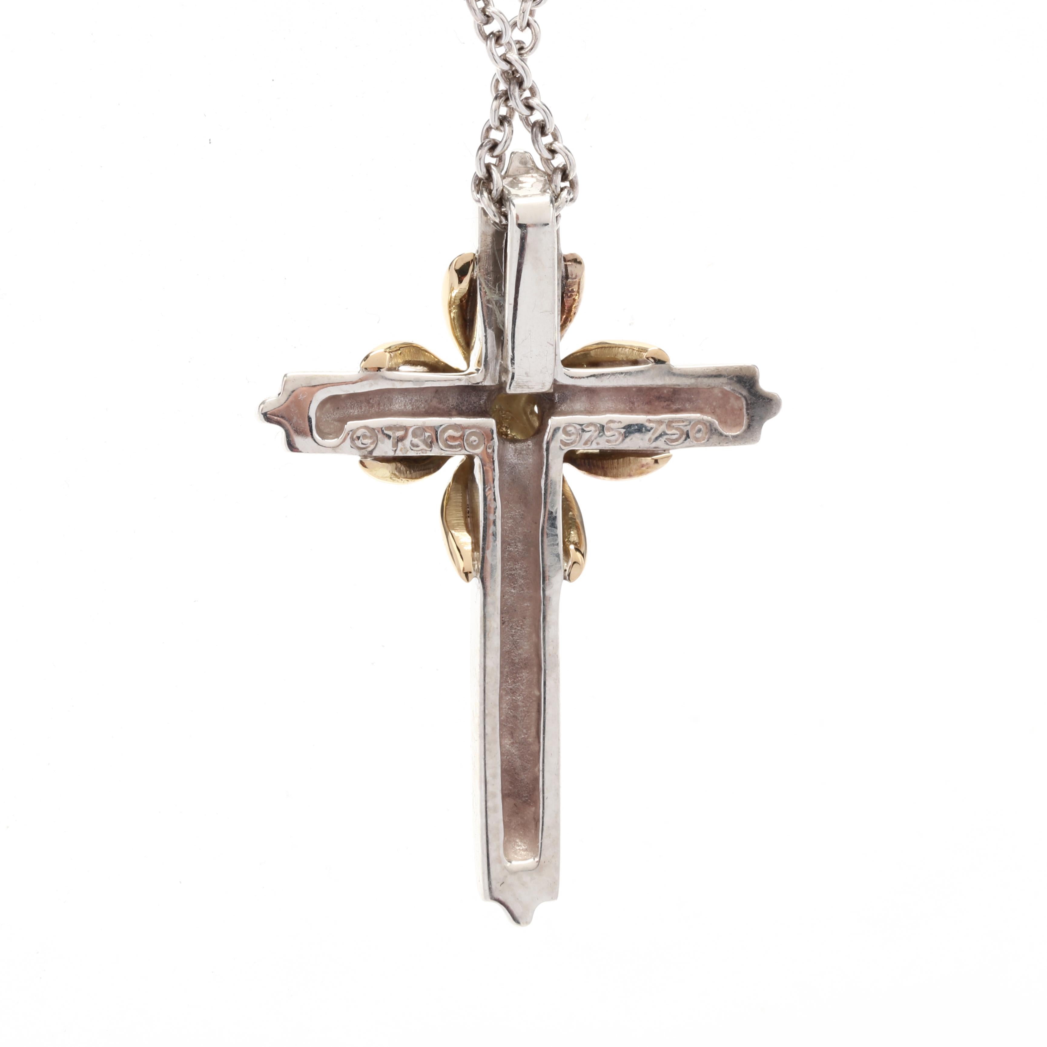 This Tiffany & Company Large Cross Necklace is a timeless and elegant piece of jewelry that is sure to make a statement. Made from 18K yellow gold and sterling silver, this necklace features a two-tone cross pendant that exudes sophistication and