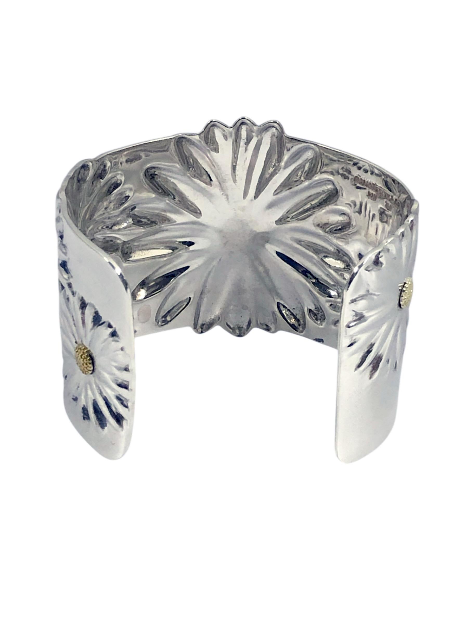 Circa 2003 Tiffany & Co Daisy Cuff Bracelet, .925 Sterling Silver with 18k Yellow Gold Accents, measuring 2 inches wide with an inside measurement of 5 1/2 inches with a 1 3/8 inch opening, slightly plyable to fit a 6 inch plus wrist. 