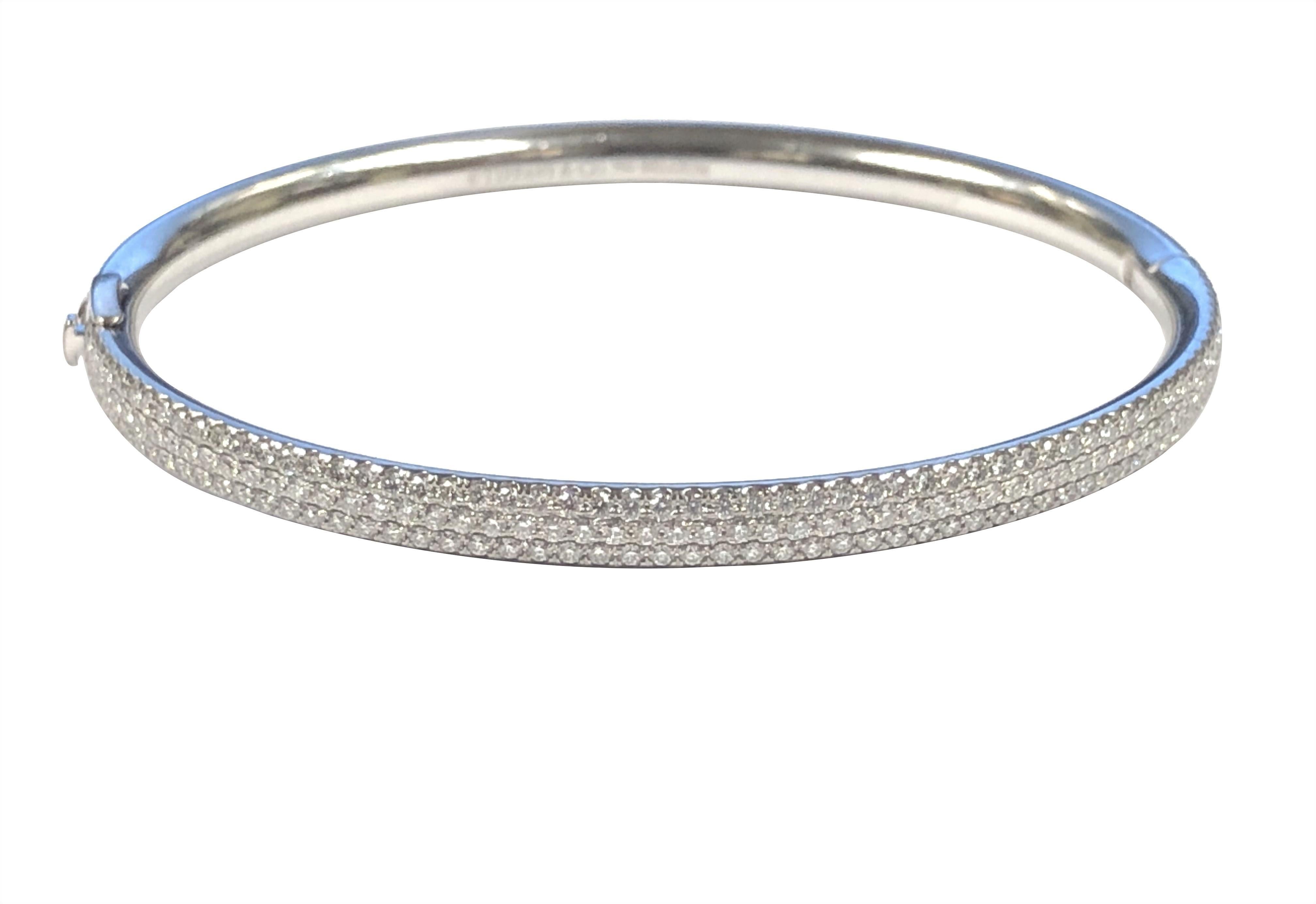 Circa 2020 Tiffany & Company Metro collection 18k White Gold Bangle Bracelet, 4 M.M. wide and set with Round Brilliant cut Diamonds totaling 3 carats. Wrist size 6 3/4 inches. Comes in a Tiffany Suede Travel Pouch. Current Retail of this piece is
