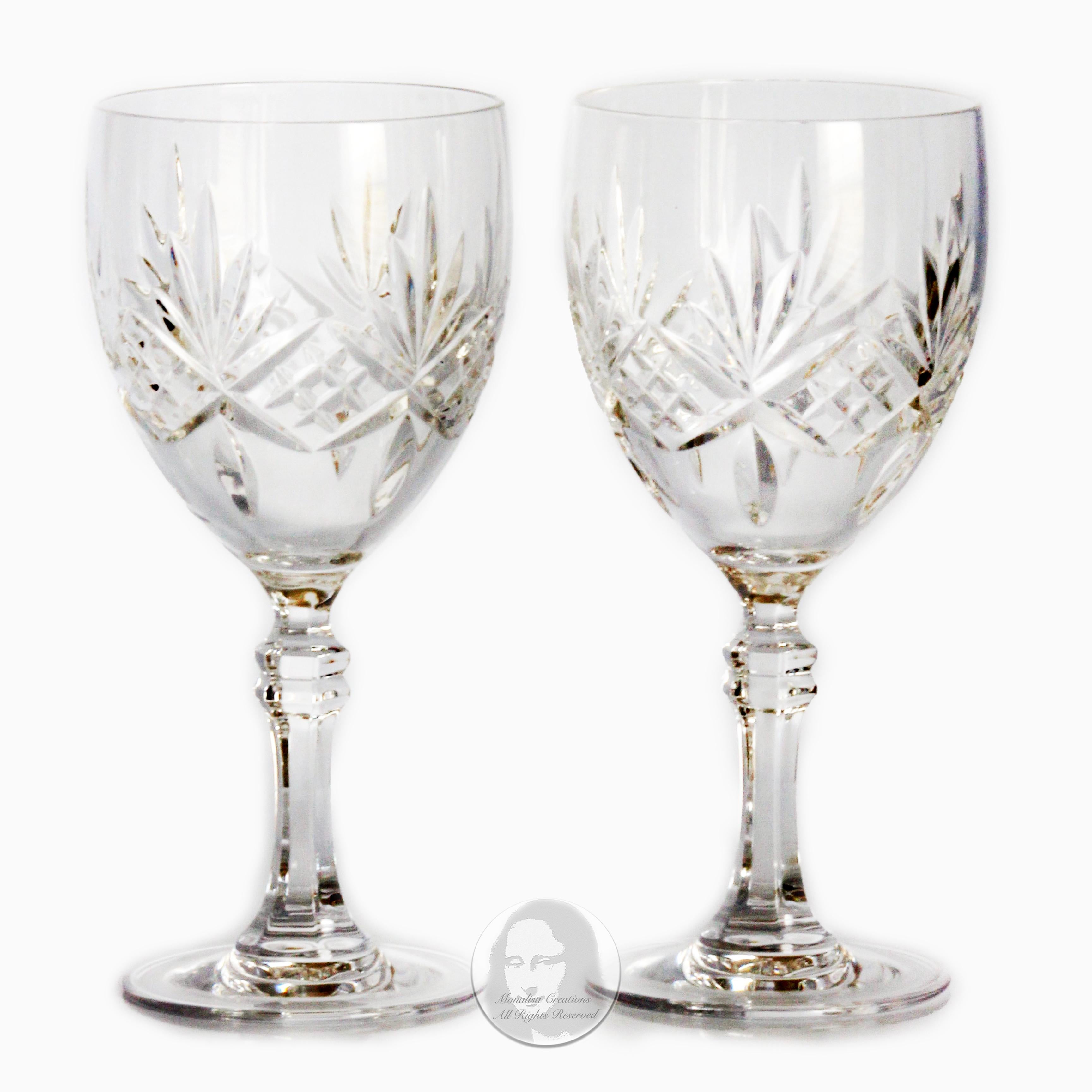 Authentic, preowned, vintage Tiffany & Company water goblets, set of 2, in box, made in 1988. A gorgeous set of fine lead crystal goblets that feature fan cuts and a decorative stem. Each glass measures approximately 7in H x 3.25in across the top,