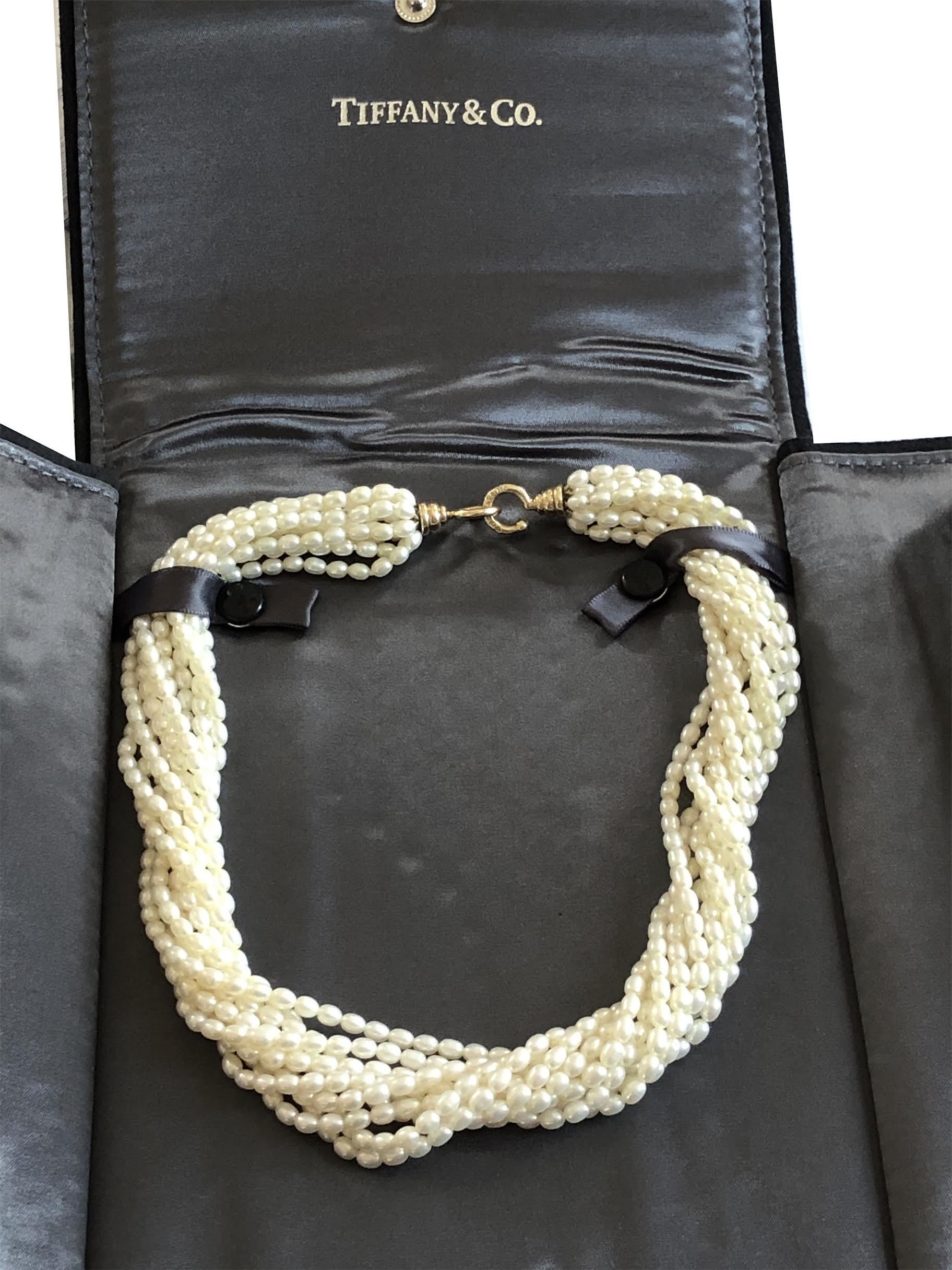 Circa 1980s Paloma Picasso for Tiffany & Company Pearl Torsade Necklace, comprised of 10 strands of Fresh water pearls measuring 4 X 3 M.M. all having a beautifully matched smooth unblemished surface and Fine White Luster. 18K Yellow Gold Hook