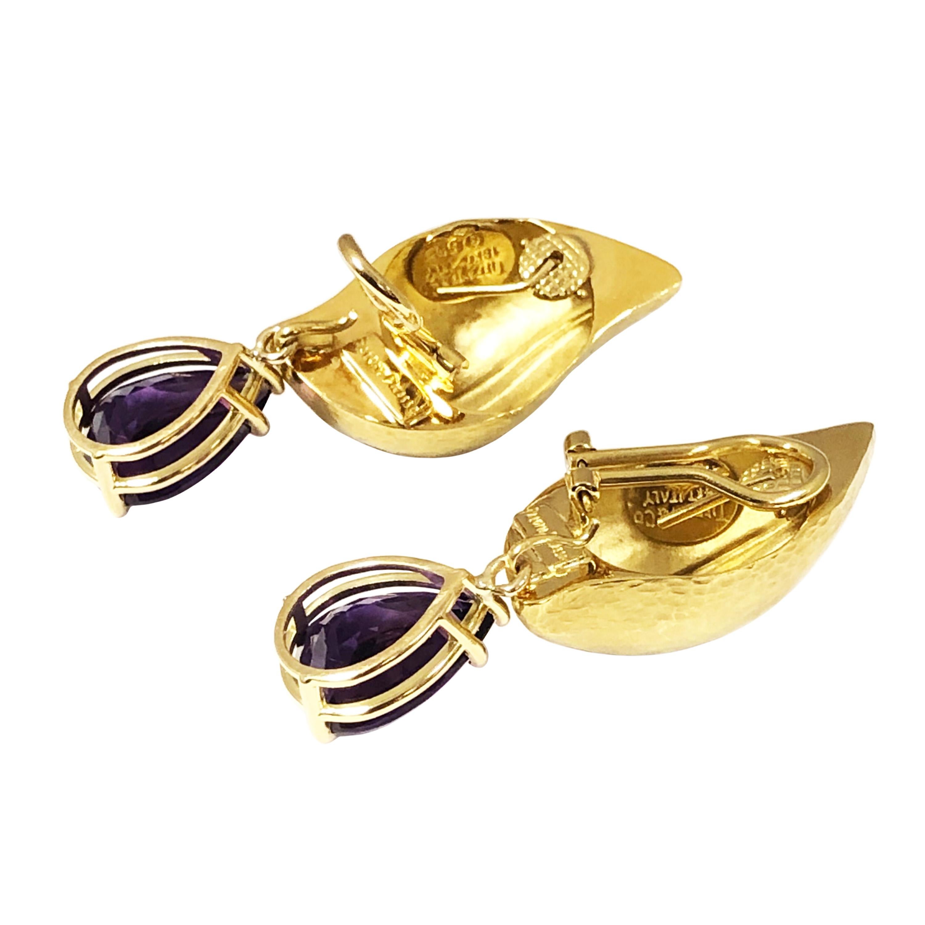 Circa 1980s Paloma Picasso for Tiffany & Company Convertible / Day Night 18K Yellow Gold Earrings. Leaf form and having a hand Hammered Finish, easy detachable bottom's of Pear shape Amethysts of very fine color and totaling in weight 14 Carats.