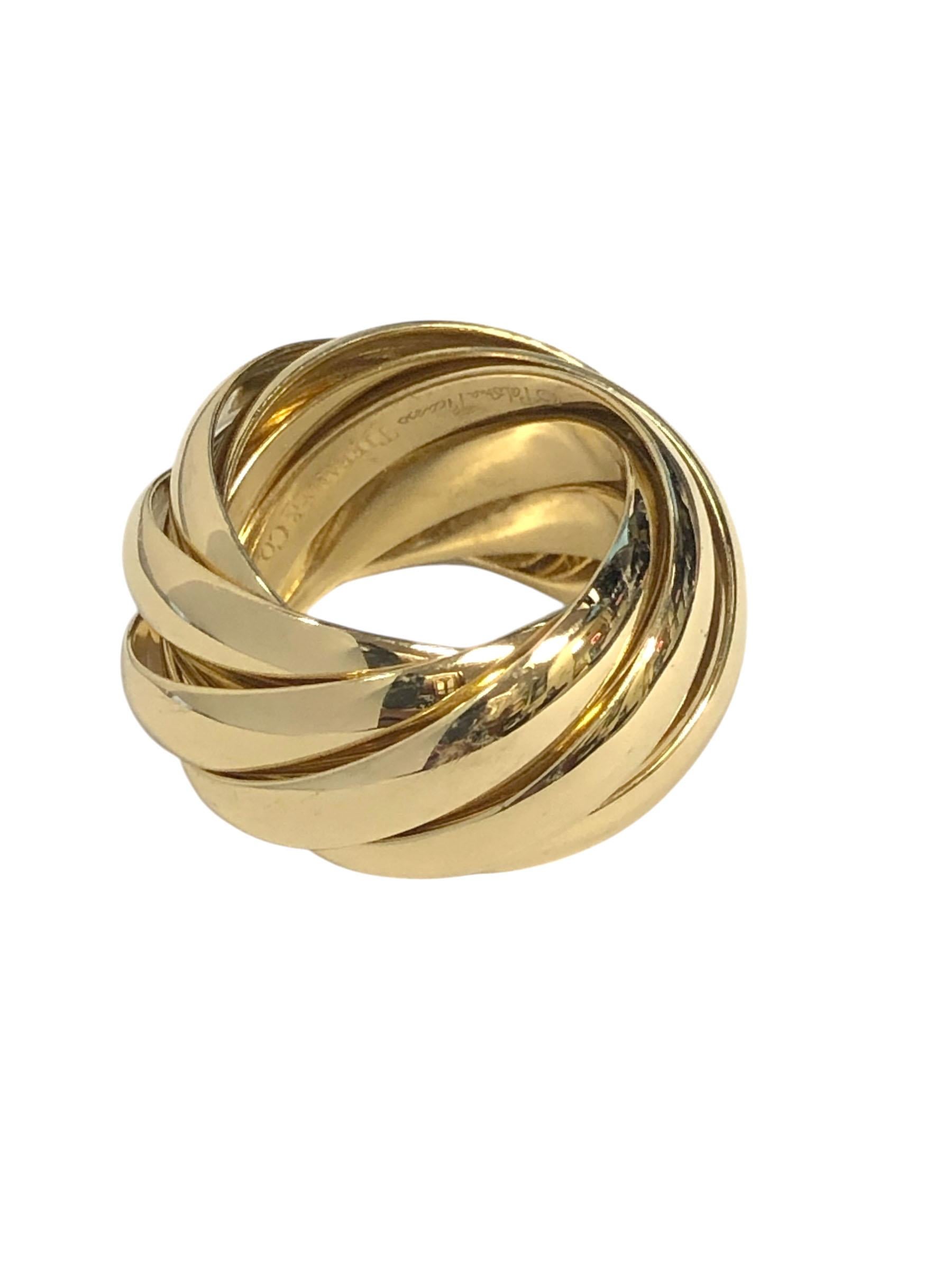 CIRCA 2020 Paloma Picasso per Tiffany & Company Collection'S Rolle in oro giallo 18k, composto da 9 anelli a fascia intrecciati, ognuno dei quali misura 3,5 M.M. e pesa 32,4 grammi. Misura delle dita 7,5. 