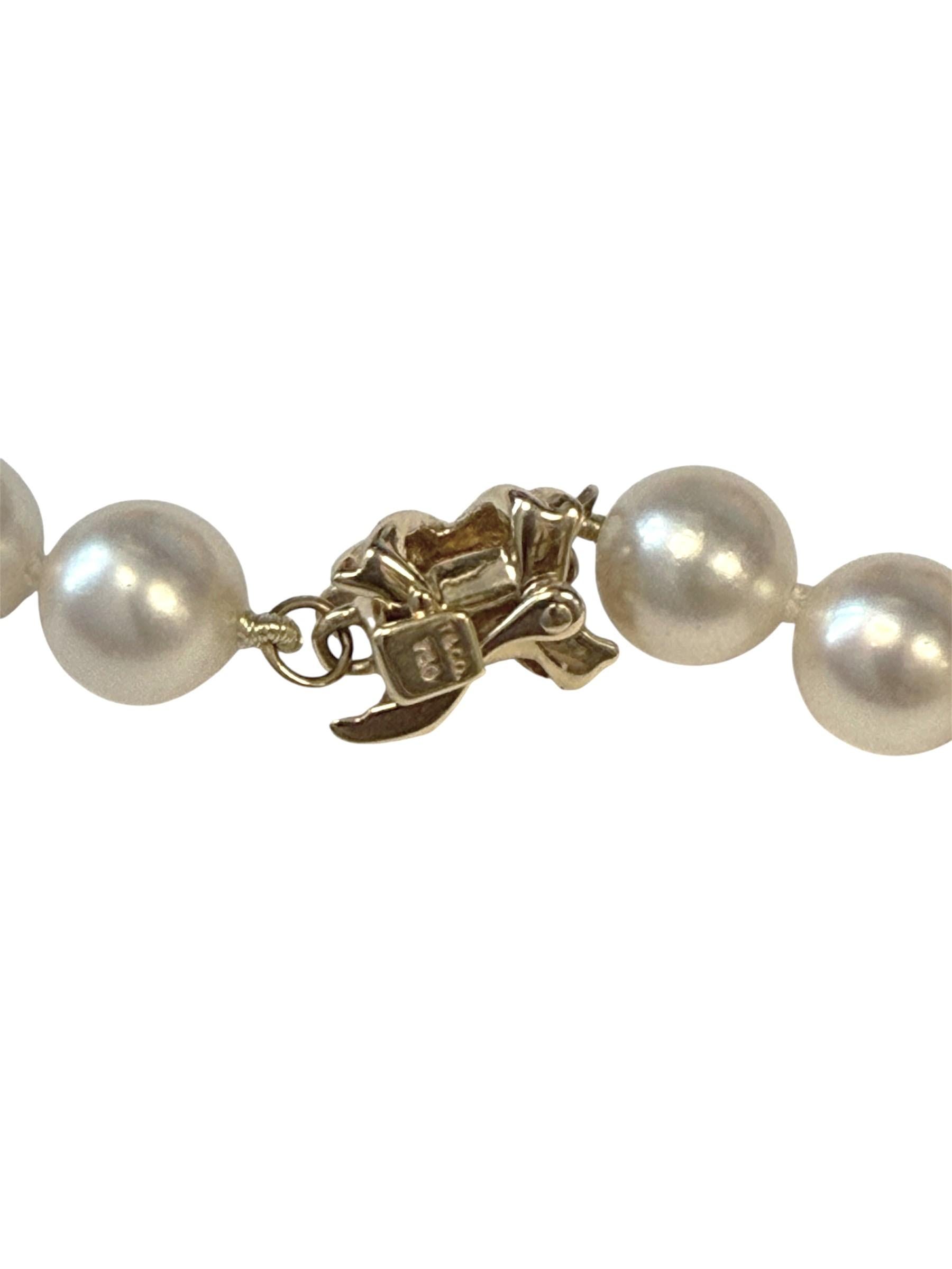 Circa 2010 Tiffany & Company Culture pearl Necklace, 18 inches in length and comprised of 7 M.M. very fine round Pearls that grade as AAA with White Cream Luster and almost no visible surface blemishes, 18k Yellow Gold Signature collection clasp.