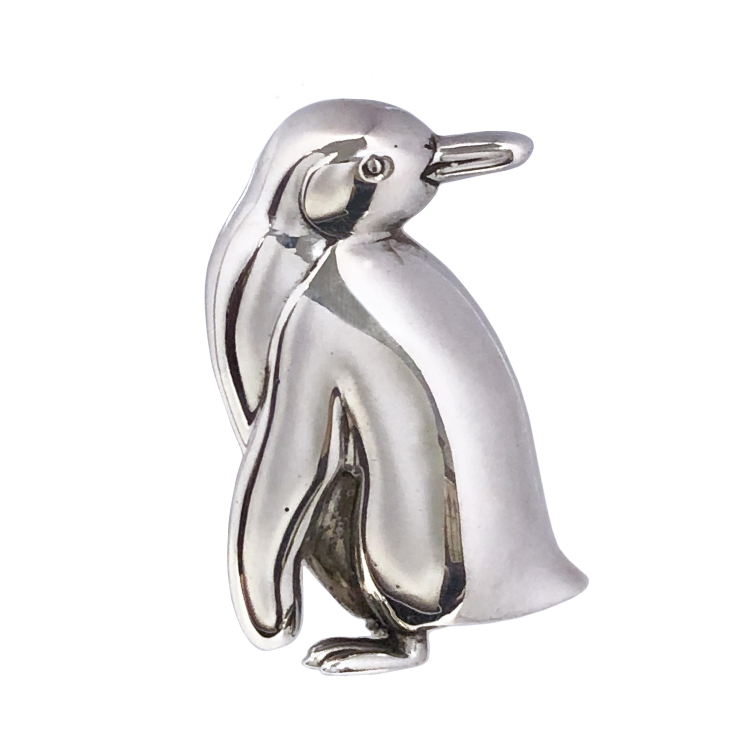 Circa 1990 Tiffany & Company Sterling Silver Whimsical Penguin Brooch. Measuring 1 1/2 inches in length and 1 inch wide, nice solid construction and detail. 