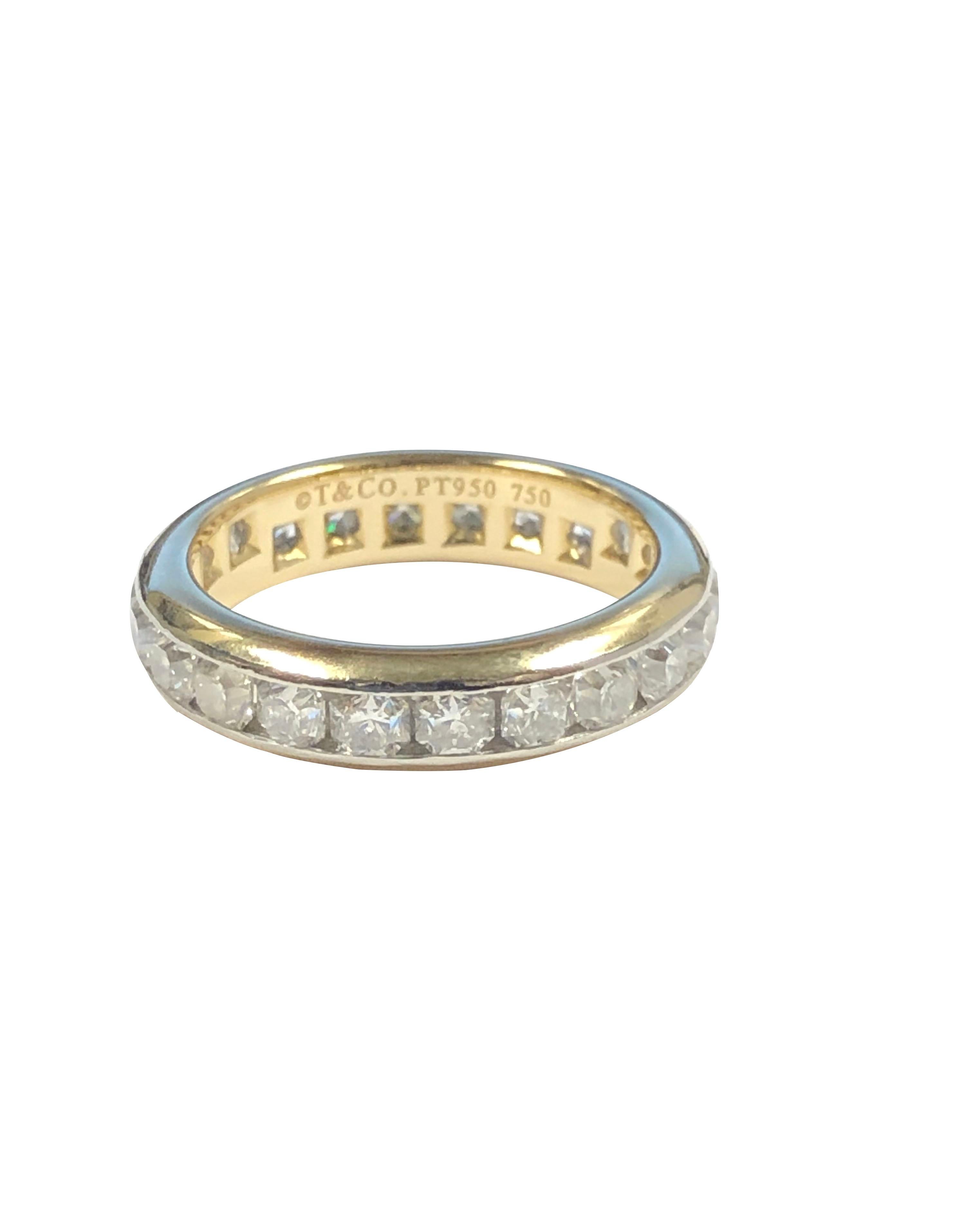 Circa 2010 Tiffany & Company Lucida Diamond collection Eternity Band Ring, 4.5 MM wide 18k and Platinum with 22 Channel set Lucida Cut Diamonds totaling 2.50 carats and grading as F - G color and VS Clarity. Finger size 7, comes in the original