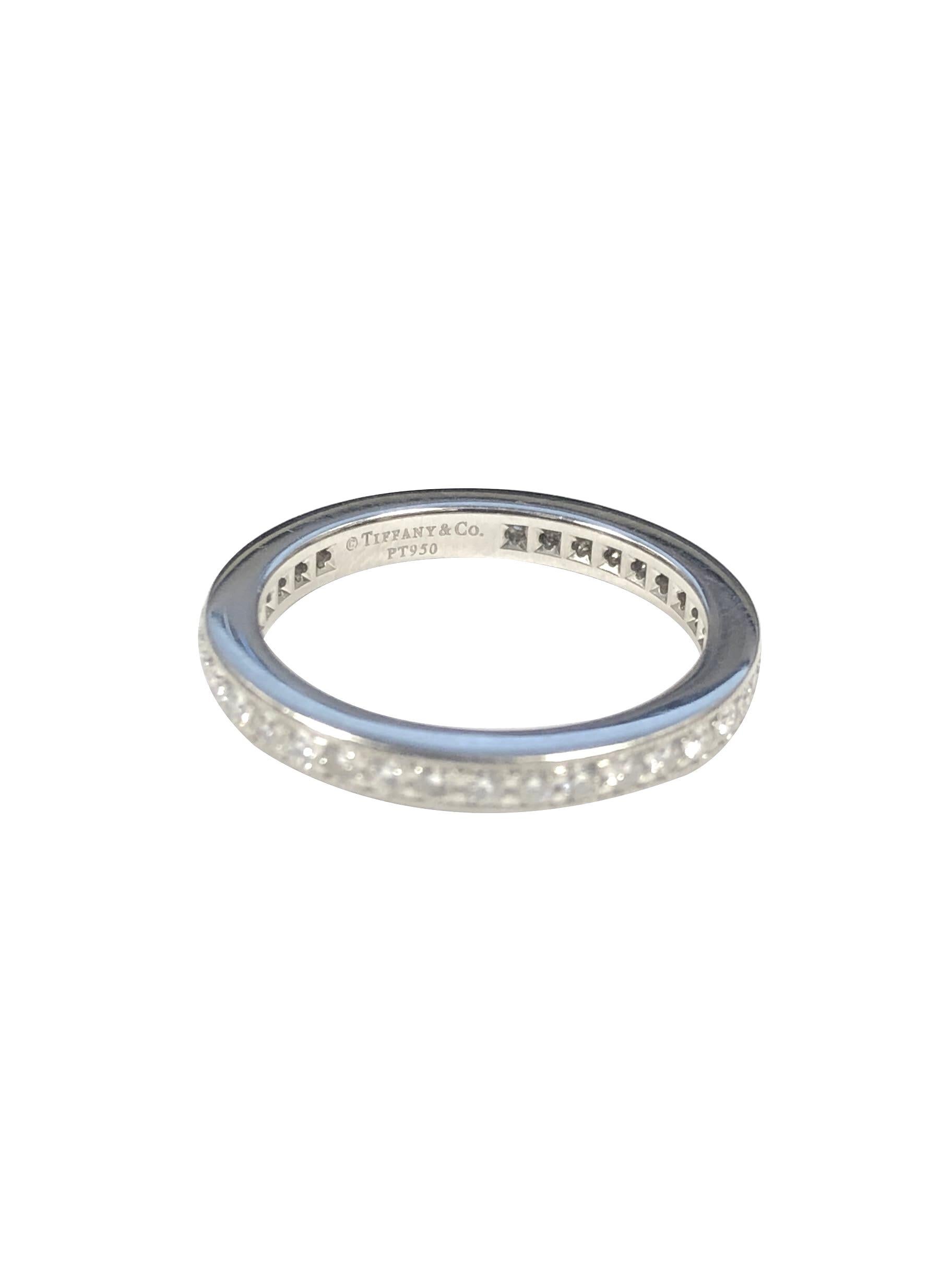 Circa 2010 Tiffany & Company Platinum Eternity Band Ring, 2 M.M. wide and containing Round Brilliant cut Diamonds totaling 1 Carat. Finger size 5. 