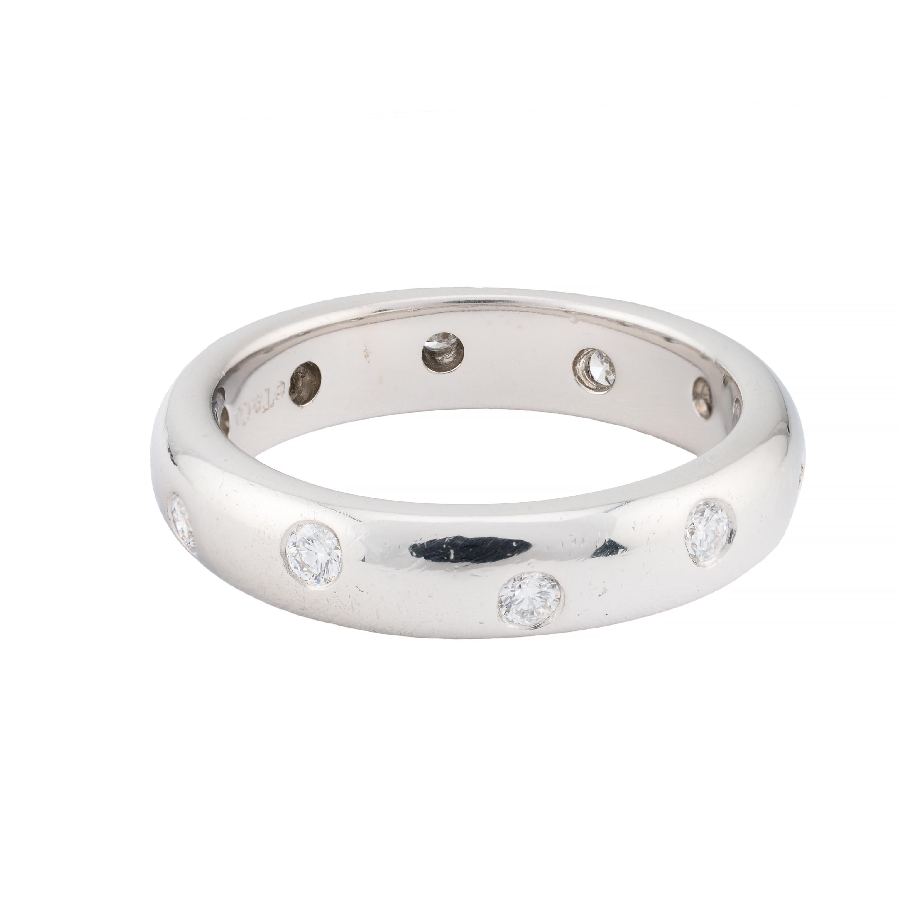 Tiffany & Co. Presents:

A refined wedding ring featuring five brilliant cut diamonds. Each diamond is set flush within the band, offering a seamless and elegant appearance. The diamonds, totaling 0.22 carats, boast VVS1 clarity and an F color