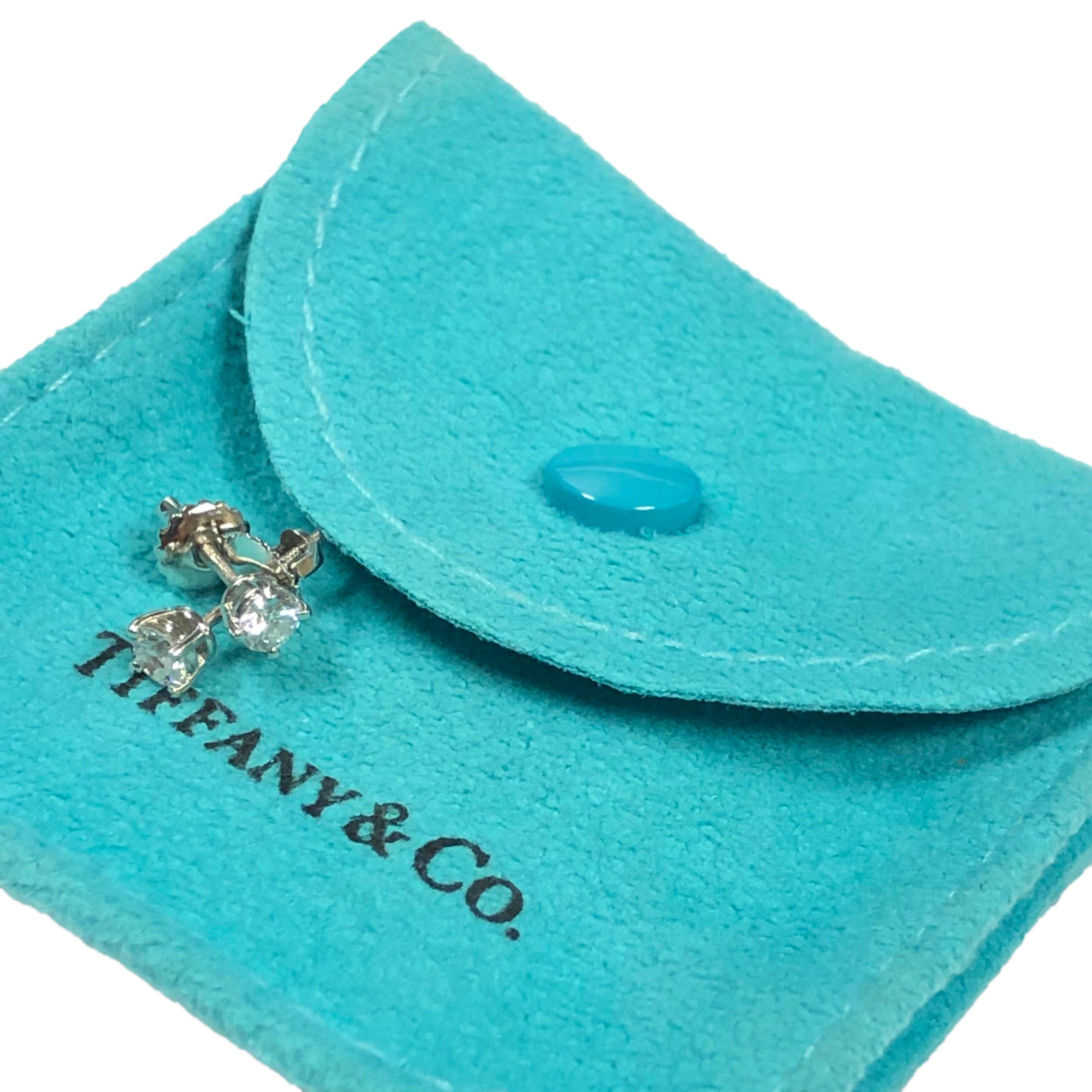 Circa 2012 Tiffany & Company Platinum and Diamond Stud Earrings, 4 Prong heads with screw backs. Round Brilliant cut Diamonds totaling .38 Carat and Grading as F - G in Color and VS in Clarity. Comes in original Tiffany Suede travel pouch. 