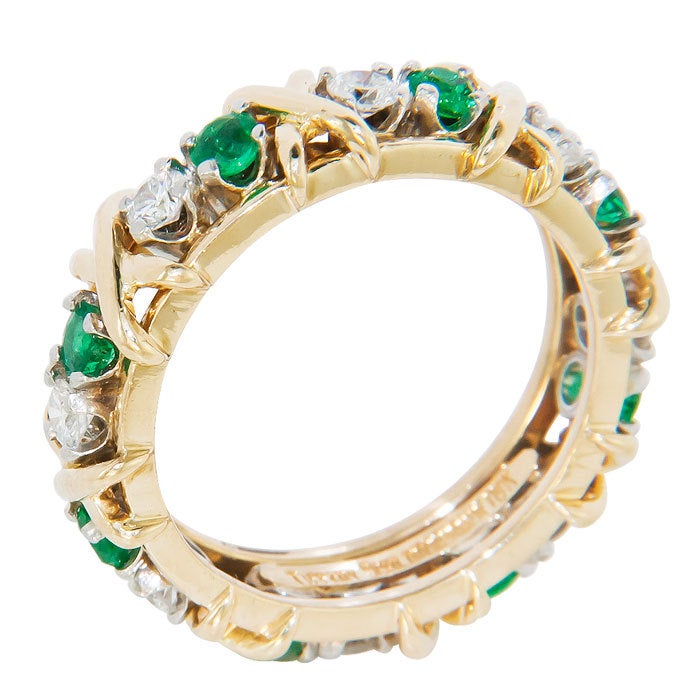 Jean Schlumberger for Tiffany & Company 18K Yellow Gold and Platinum Diamond and Emerald 16 stone  X  Ring. .65 Carat of Round Brilliant cut Diamonds and very fine color Emeralds totaling .65 as well. Finger size = 6