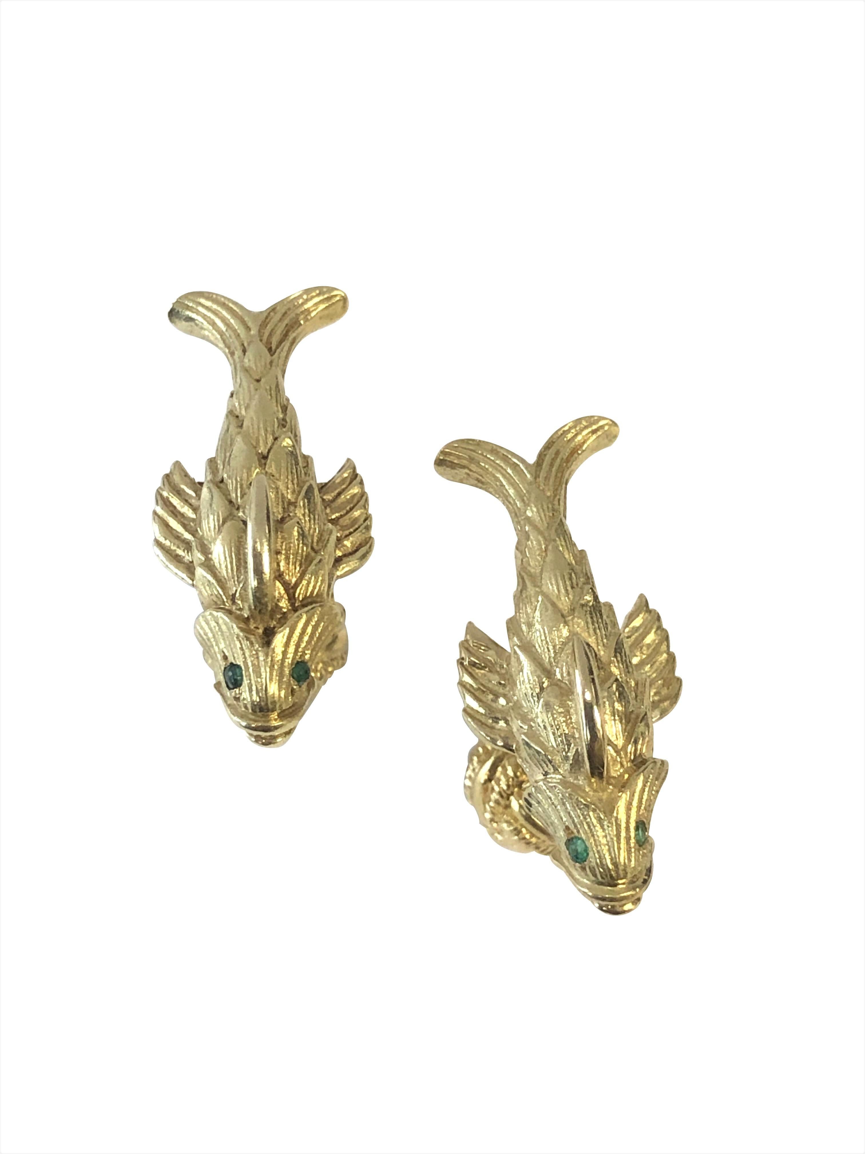 Circa 1990 Jean Schlumberger for Tiffany & Company 18K Yellow Gold Fish Form Cufflinks. The tops measure 1 1/8 inch in length X 1/2 inch wide, solid heavy construction, nicely detailed and having Cabochon Emerald Eyes. 