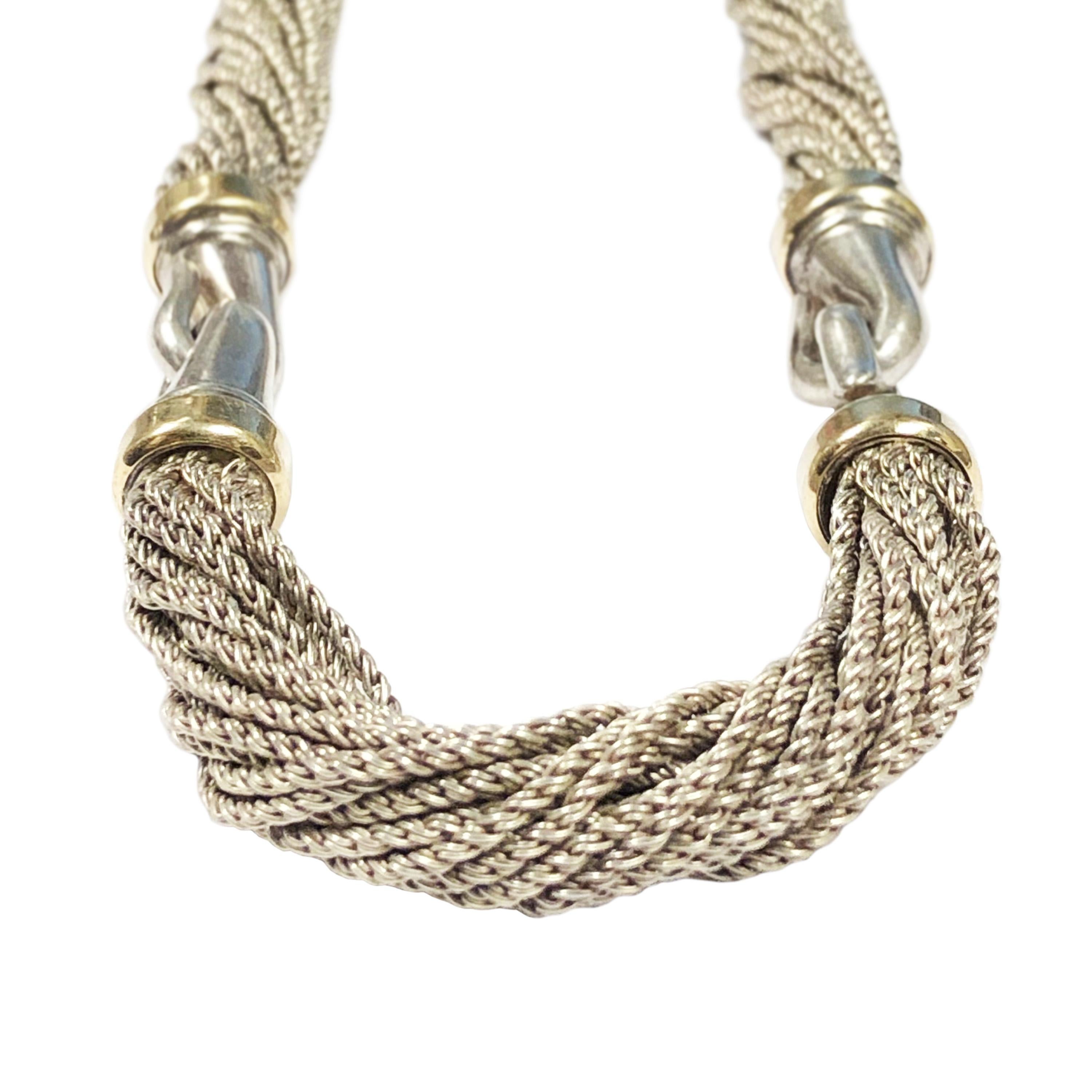 Circa 1980s Tiffany & Company Sterling Silver and 18K Yellow Gold Torsade Necklace. Measuring 16 1/4 inches in length and 3/8 inch wide. Comprised of 3 sections of soft woven multiple chain connected by stations of solid silver and 18K yellow Gold.