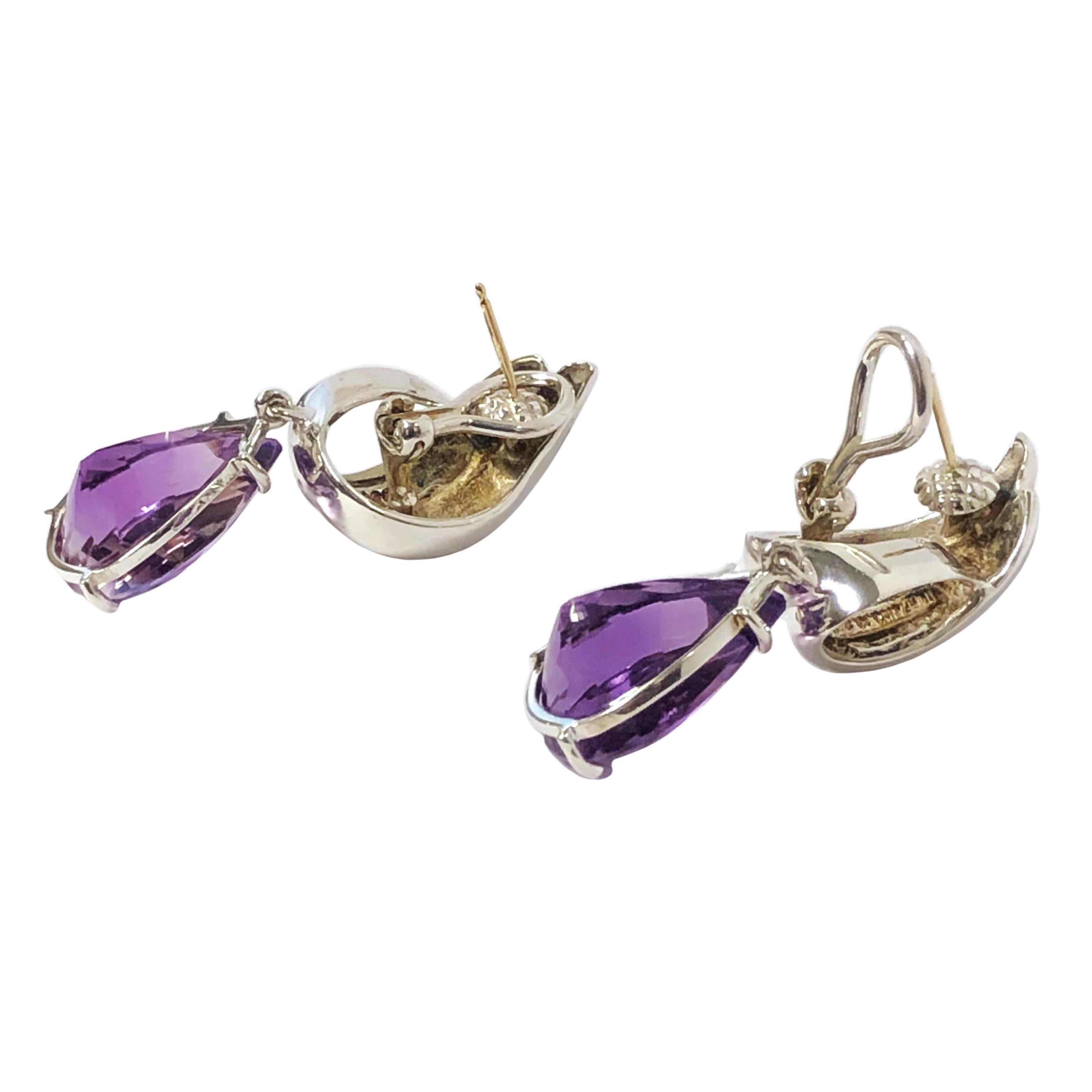 Circa 1980s Tiffany & Company Sterling Silver earrings, measuring 1 3/4 inches in length, the Pear shape Amethysts measure 19 X 13 X 10 approximately 5 carats each. Omega Backs with a Post. Come in a Tiffany suede Travel Pouch.
