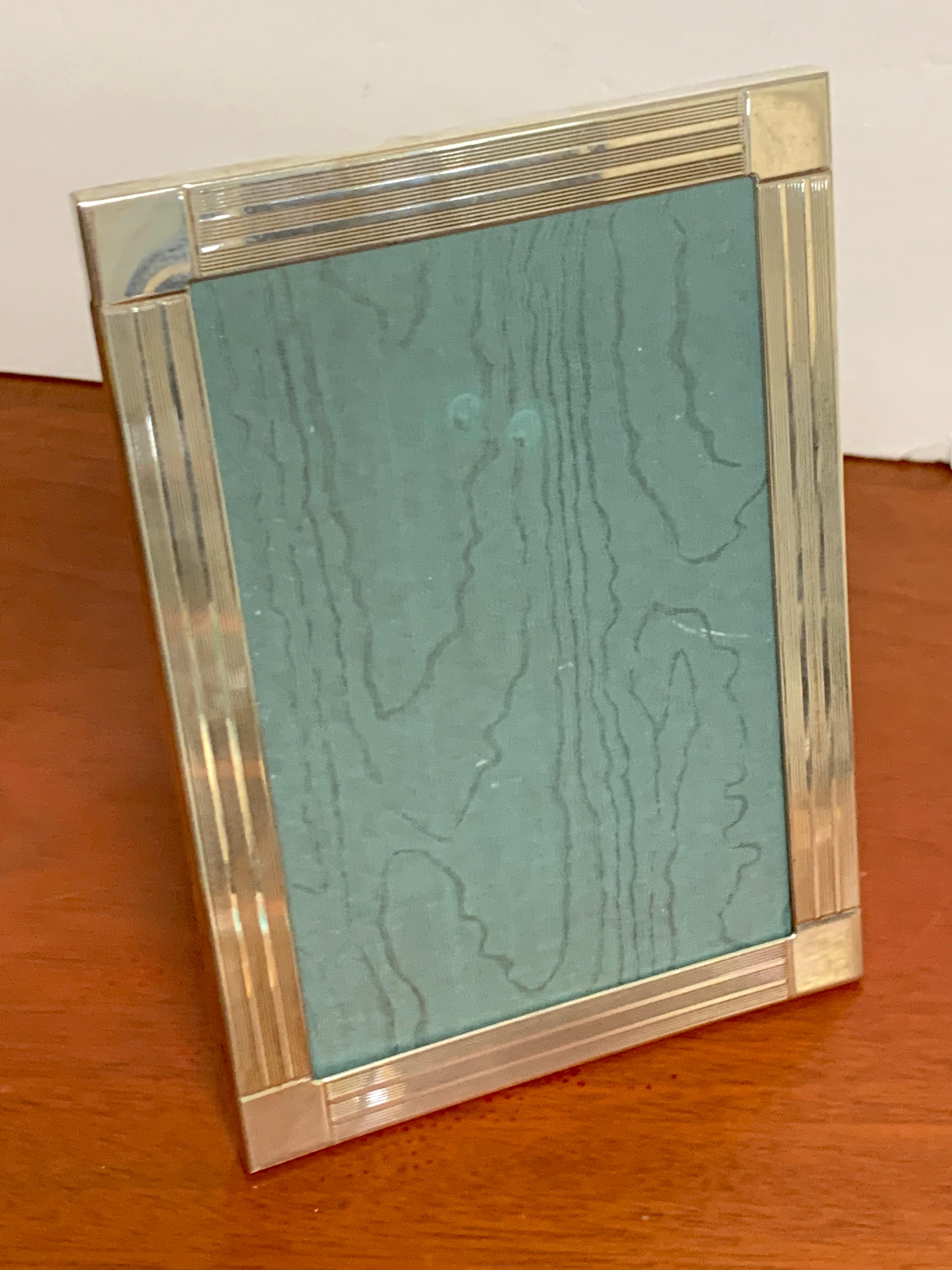 Tiffany & Co. sterling frame, Frank Lloyd Wright style
with subtle engraved Frank Lloyd Wright style decoration with sturdy wood back. Hallmarked, Italy, .925
displays a 4”x 6