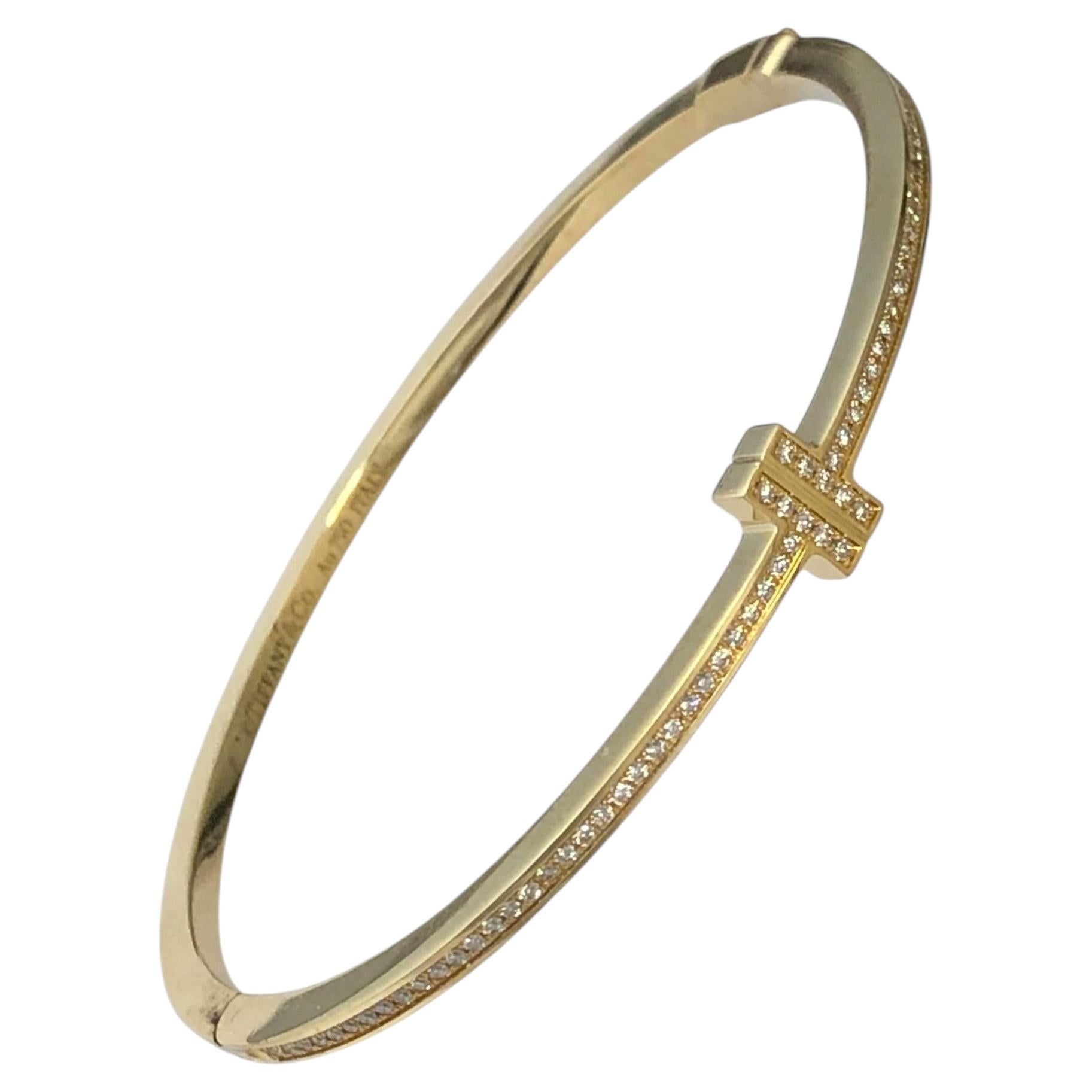 Tiffany & Company „T“ Armreif aus Gelbgold und Diamanten