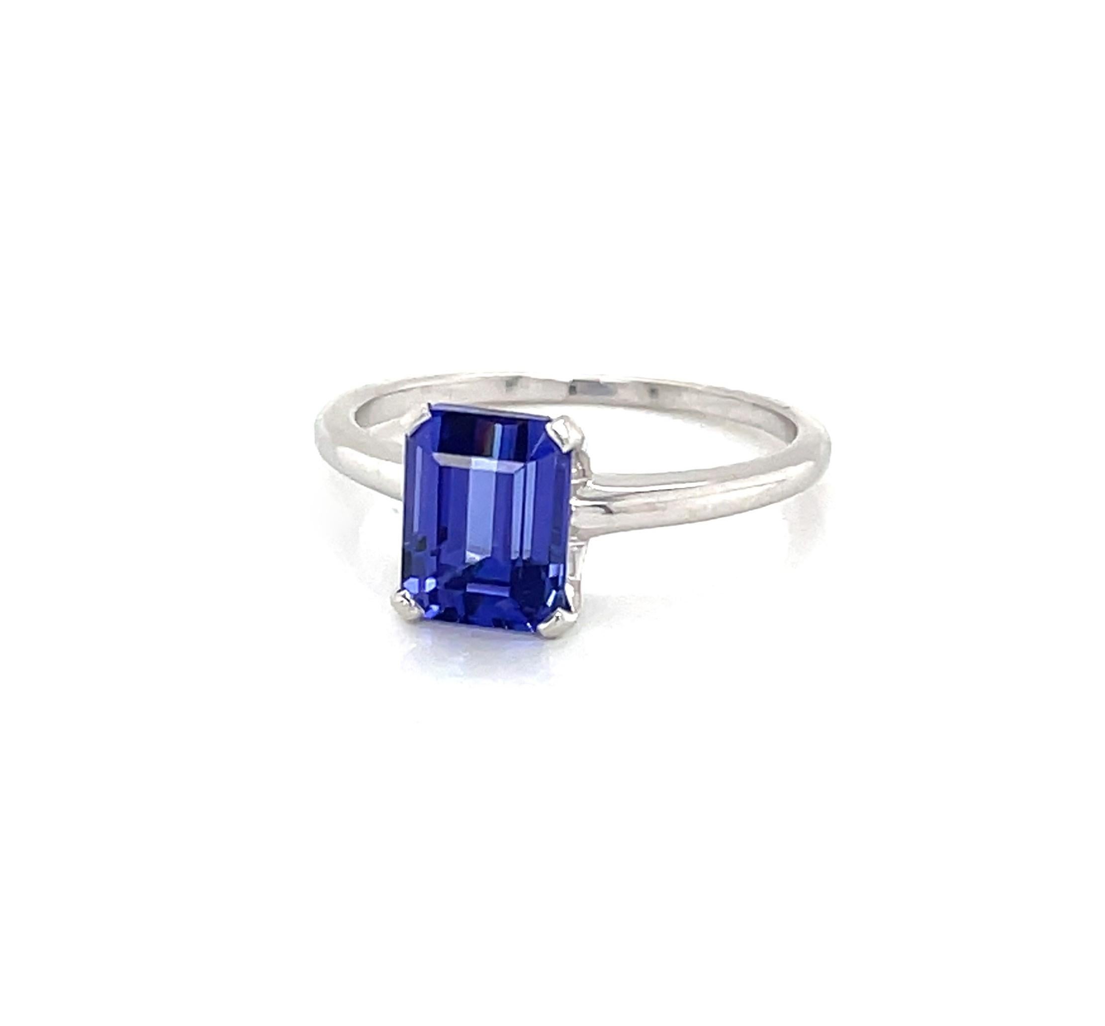 The stunning natural beauty of this blue violet 2.08 carat emerald cut tanzanite gemstone is accentuated by its sophisticated yet simplistic design by Tiffany & Company. This outstanding vintage Tiffany ring, for engagement or a special occasion, is