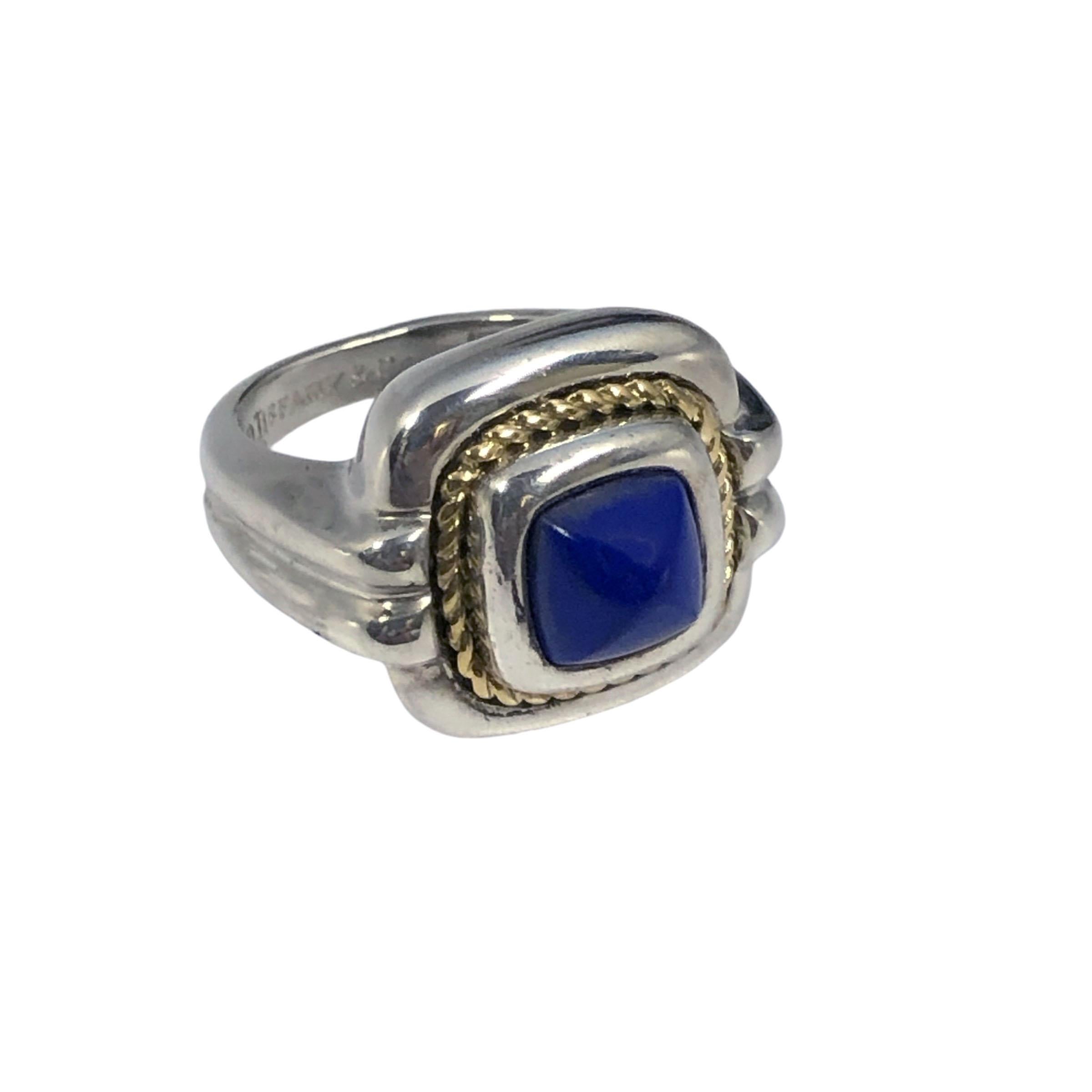Circa 1980s Tiffany & Company ring, Sterling Silver with an 18K Yellow Gold twisted Rope Bezel, the top measures 5/8 x 5/8 inch and is centrally set with Cabochon Pyramid Lapis Lazulli. Finger size 6. 