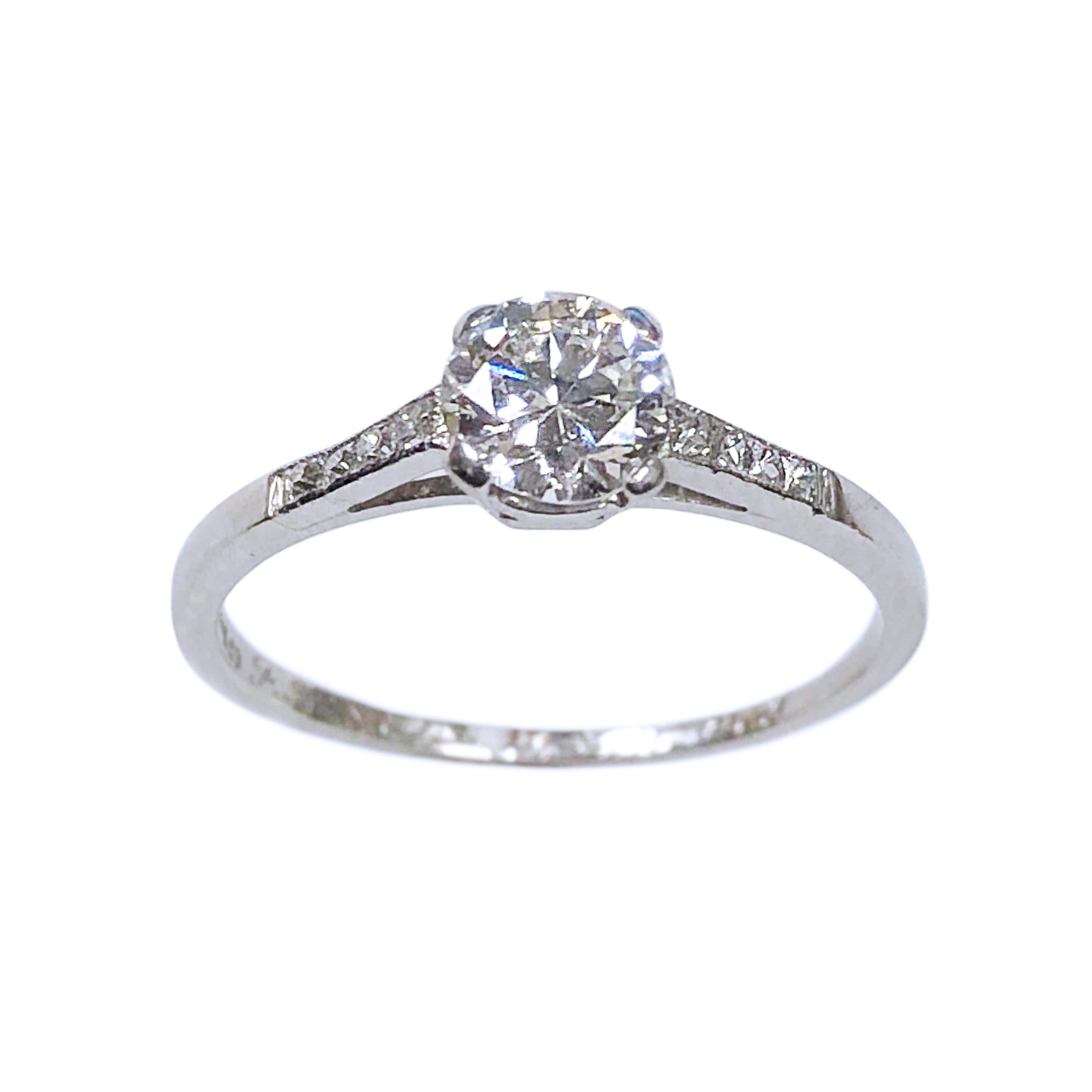 Circa 1930s Tiffany & Company Platinum Engagement Ring set, Centrally set with a 1/2 carat Round Brilliant cut Diamond grading as H in Color and VS in Clarity flanked on either side by French cut Diamonds totaling .15 carat.  Finger size 5 1/2, the