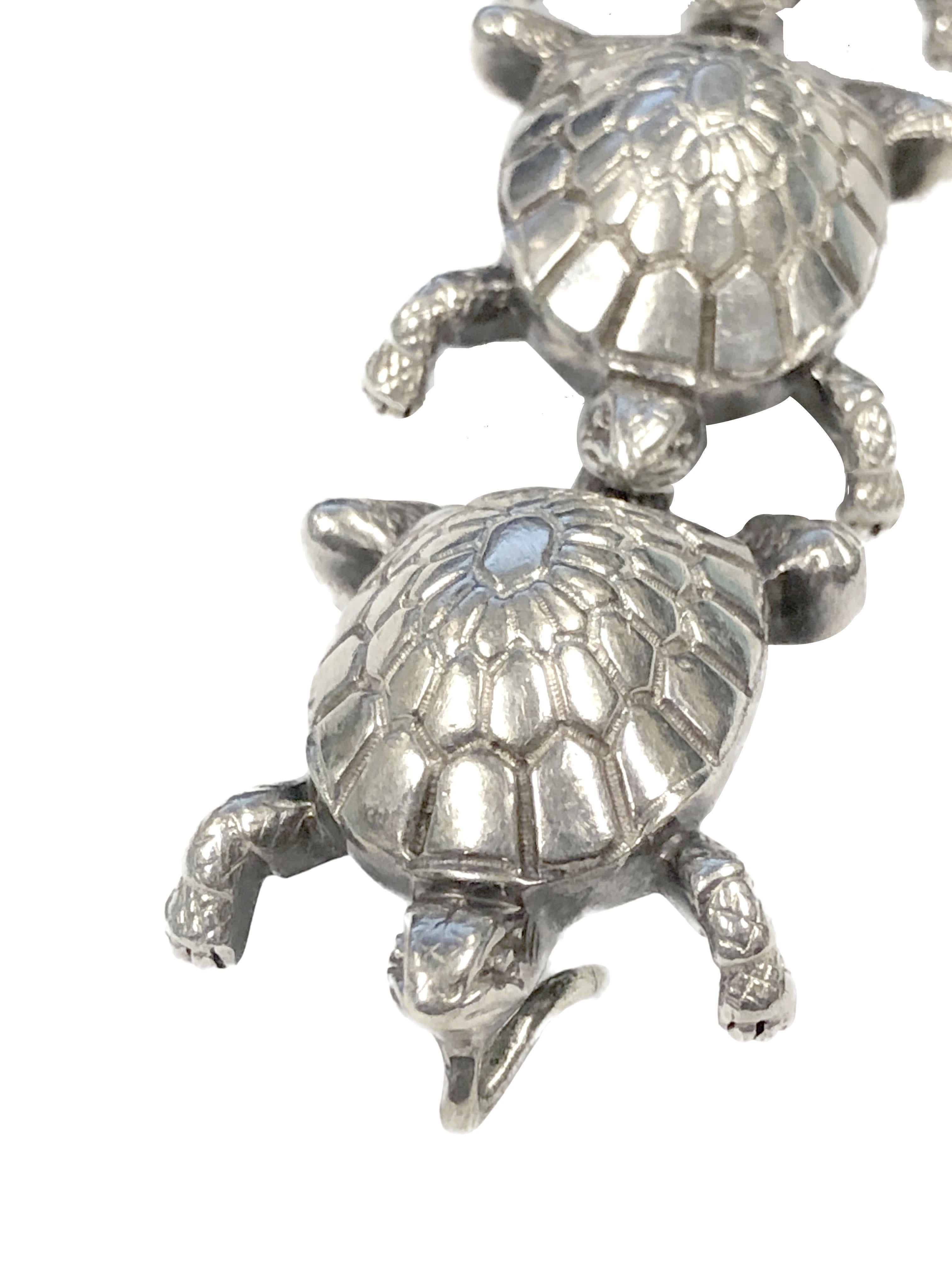 Circa 1990 Tiffany & Company Sterling Silver Turtles Bracelet, measuring 7 inches in length and 1 inch wide, individually joined Turtles for flexibility and very well detailed, nice solid construction and weighing just under 3 ounces. Comes in