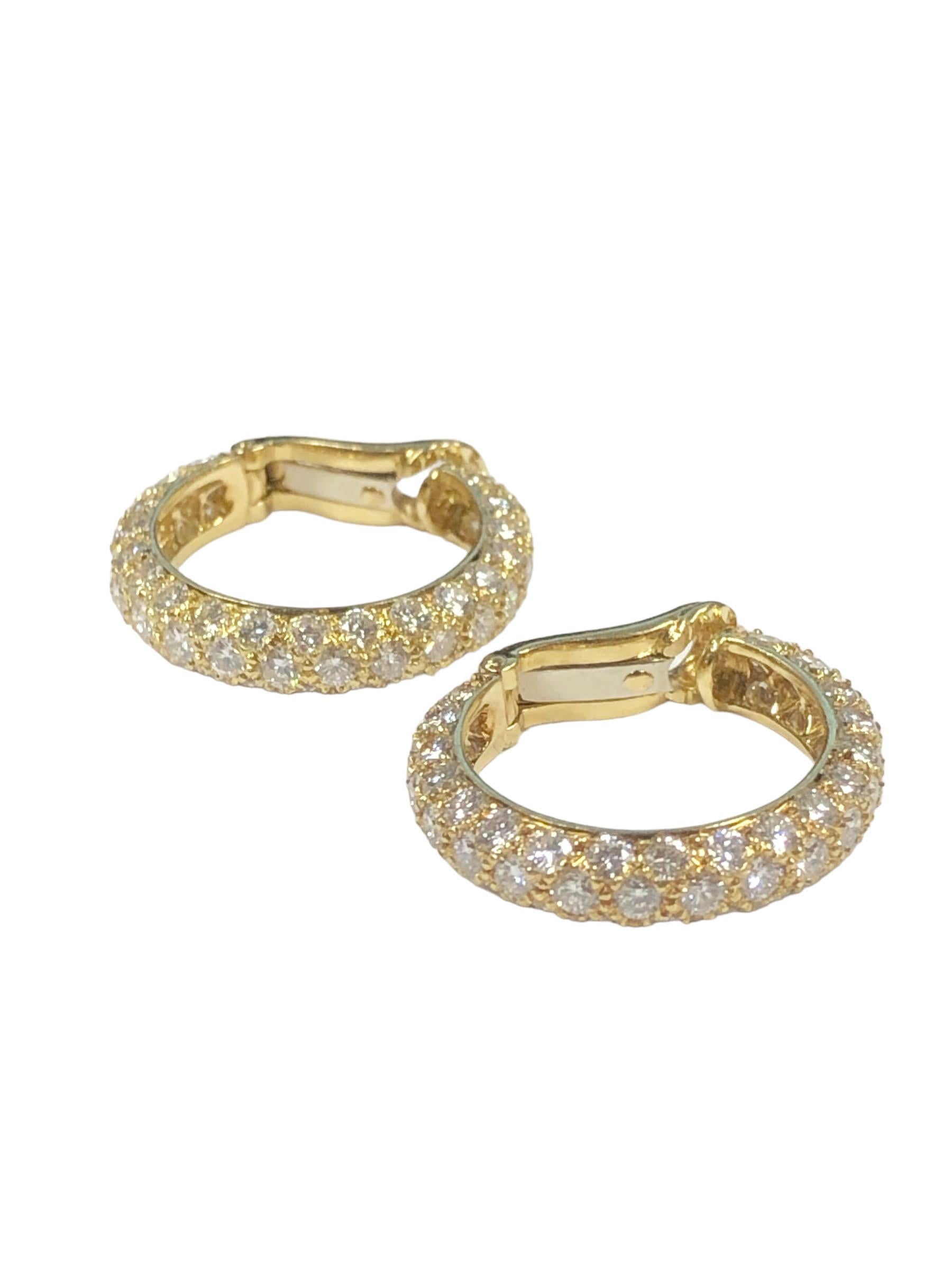 Circa 2010 Tiffany & Company Hoop Earrings, measuring 3/4 inch in diameter, 5/8 inch in length and 1/8 inch wide. Set with 110 Round Brilliant cut Diamonds totaling 3 Carats and being G in Color and VS in Clarity. Having Clip Backs to which a post