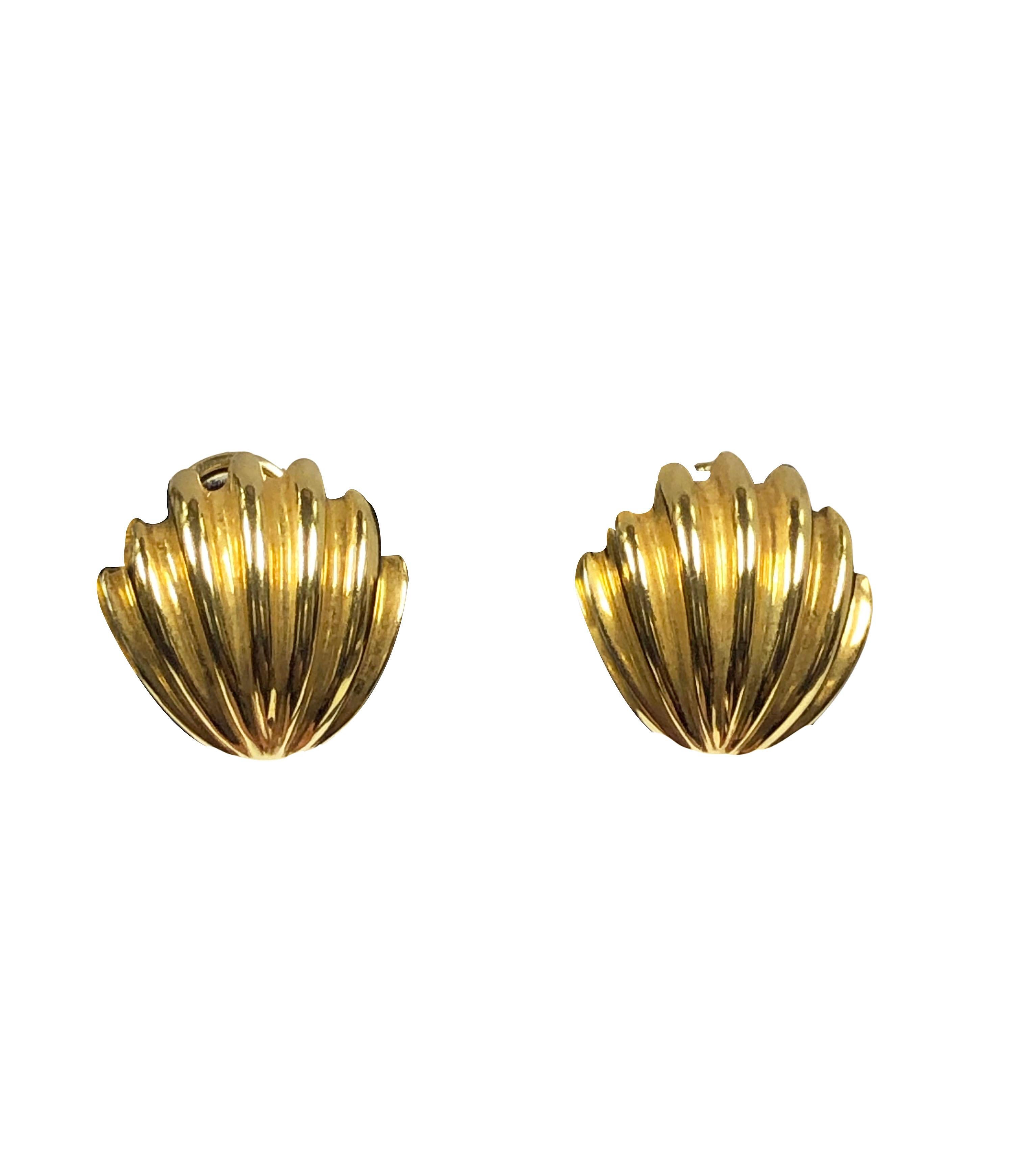 Circa 2000 Tiffany & Company 18k Yellow Gold Shell form Earrings, measuring 5/8 inch in length X 5/8 inch wide and weighing 9.9 Grams. Having Omega clip backs to which a post can be easily added if desired. Comes in a Tiffany Suede travel pouch. 