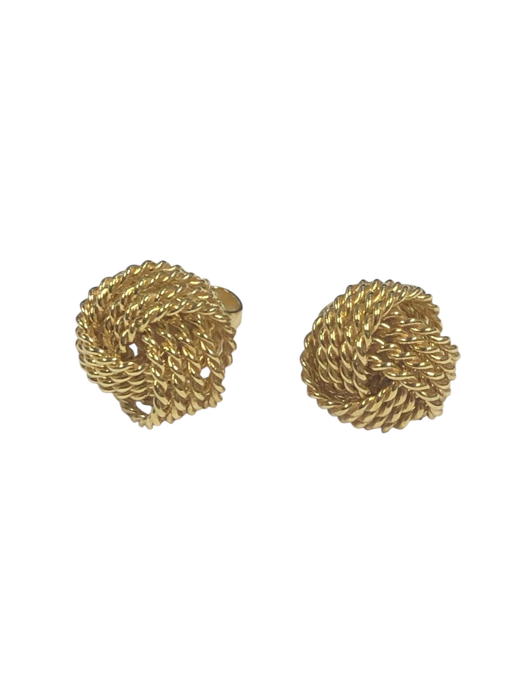 Circa 2015 Tiffany & Company 18k Yellow Gold Twisted Rope Knot Earrings, measuring 3/8 inch in diameter and 5/16 inch in depth. Weighing 4.1 Grams. Comes in Tiffany Suede travel pouch.