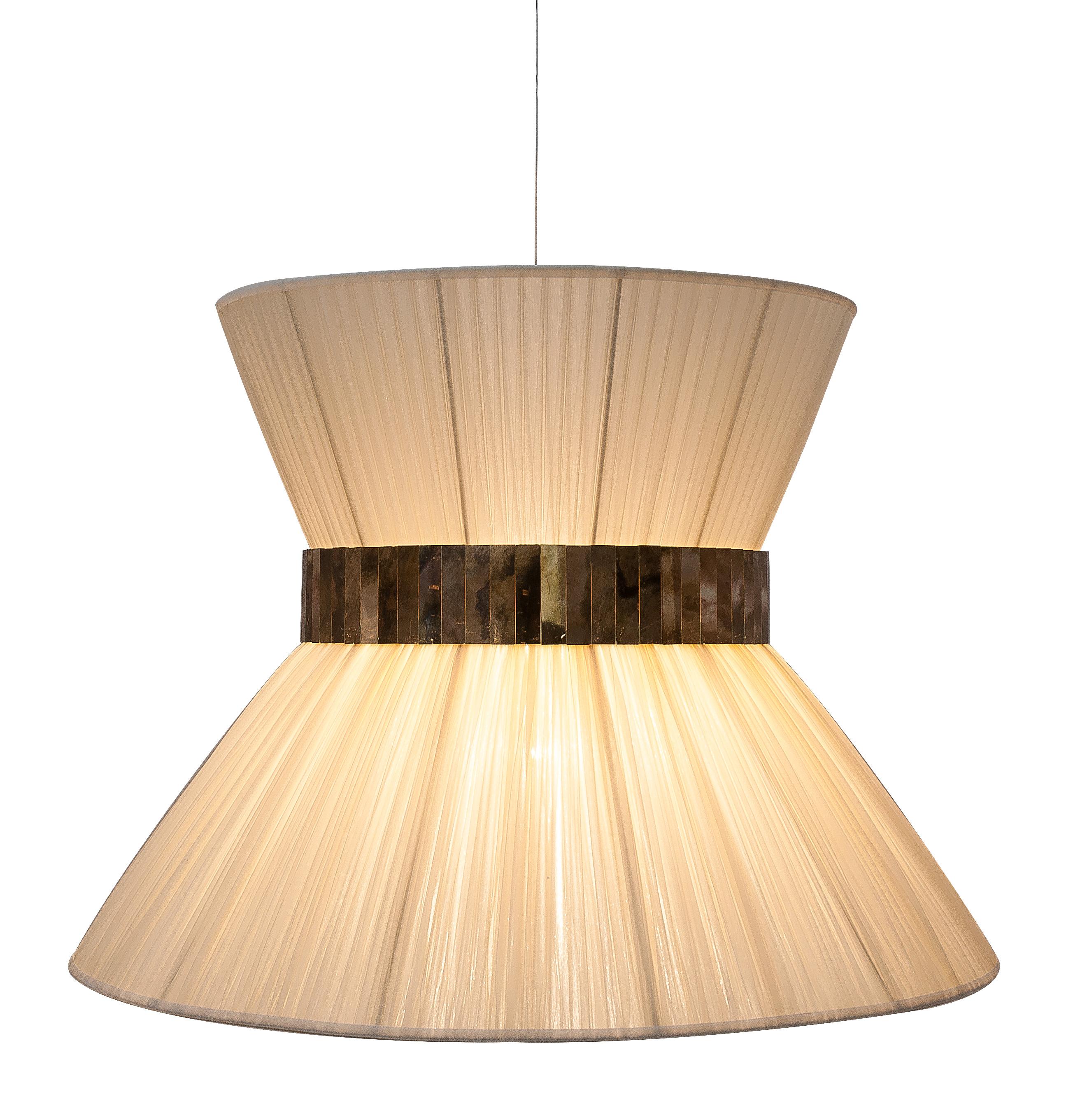 This light object  is a contemporary piece, entirely made in Tuscany and produced 100% by hand in Sabrina Landini's atelier. 
The Tiffany lamp is Sabrina's first creation and is inspired by Audrey Hepburn's timeless charm. Attractive, transversal,