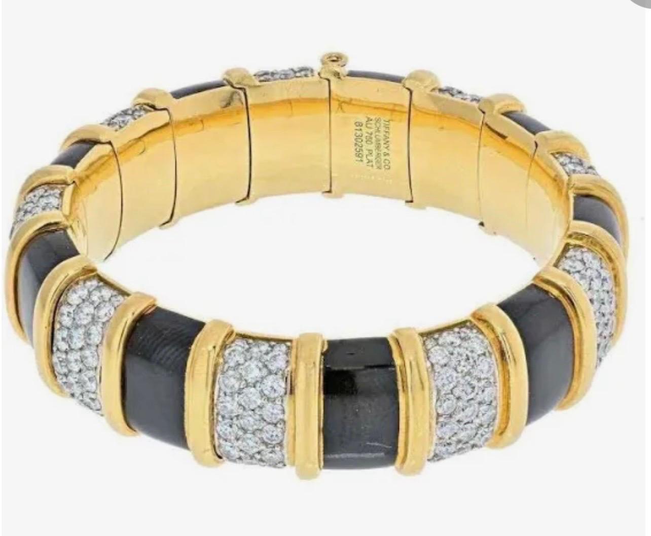 Enamel in perfect condition , No chip , no scratch
 Diamond Bracelet featuring 9 links with a total of 207 prong set round brilliant cut diamonds with a total estimated carat weight of 20 carats set in platinum and nine panels of Black enamel in 18