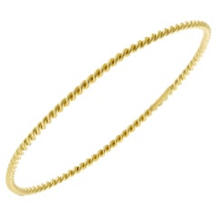 Tiffany & Co.'s 18kt Gold Twisted Wire Bangle Bracelet