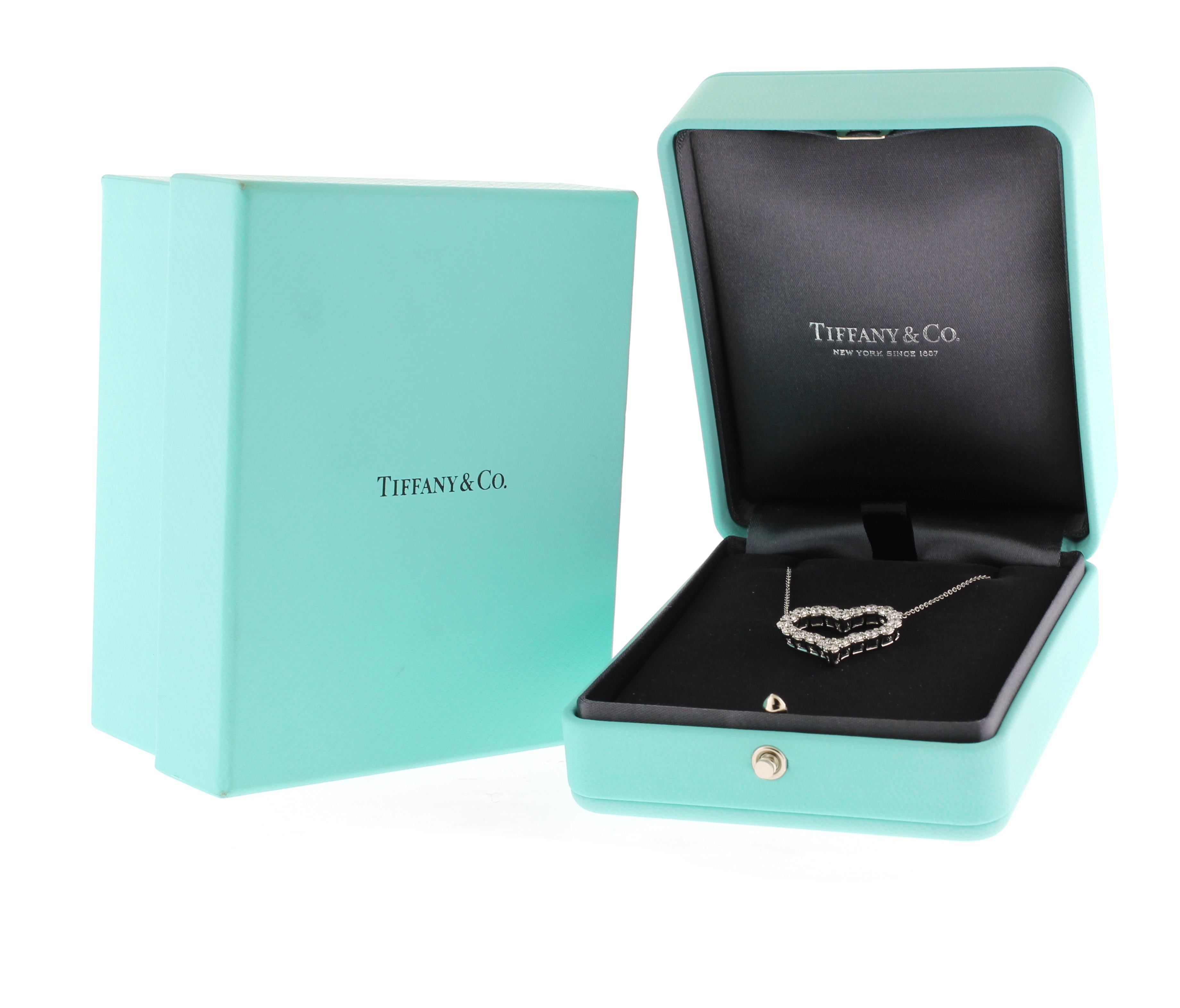 From Tiffany & Co., this is the large platinum heart pendant with 20 diamonds.
• Designer: Tiffany & Co.
• Metal: Platinum
• Circa: 2022
• Diamond: 20=1.96 carats
•  Length: 16 inch chain
• Packaging:  Original Tiffany Box
• Condition: Excellent

