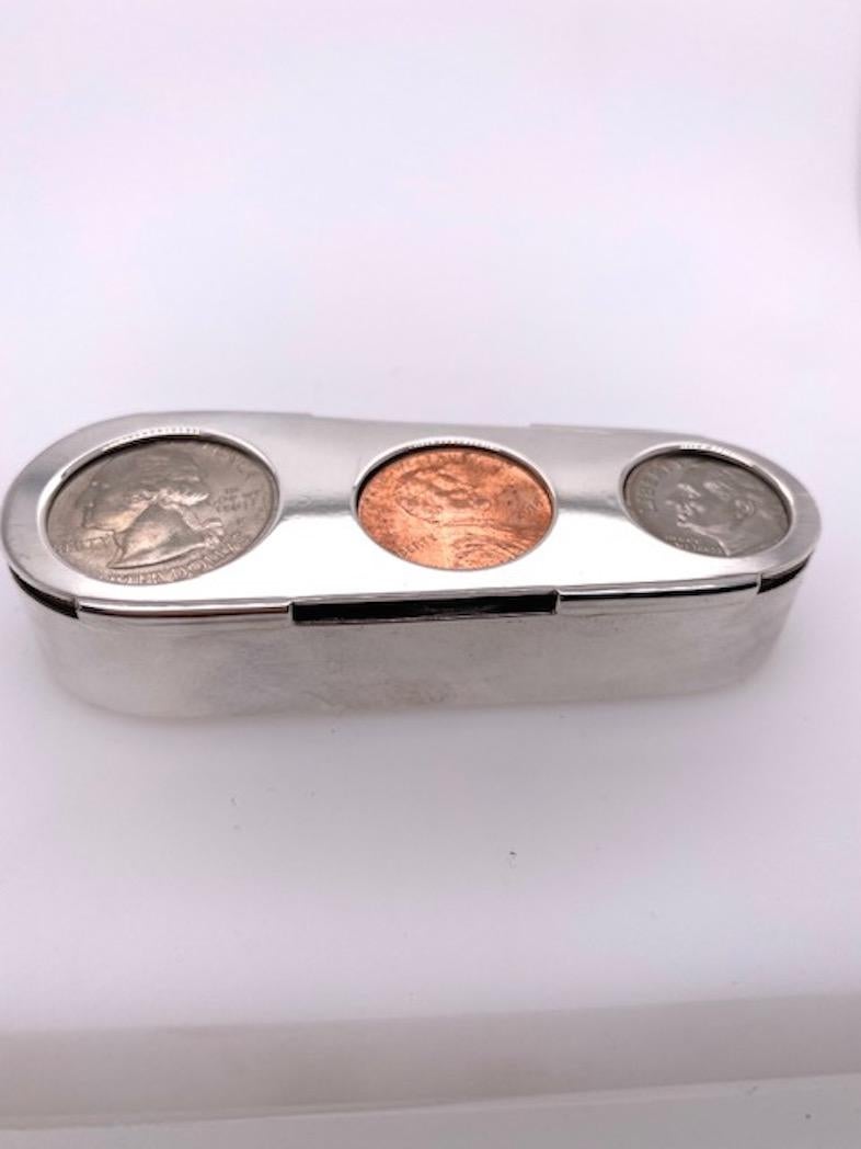 Sterling silver coin holder for quarters, dimes and pennies.  Made and signed by TIFFANY & CO.  2 7/8